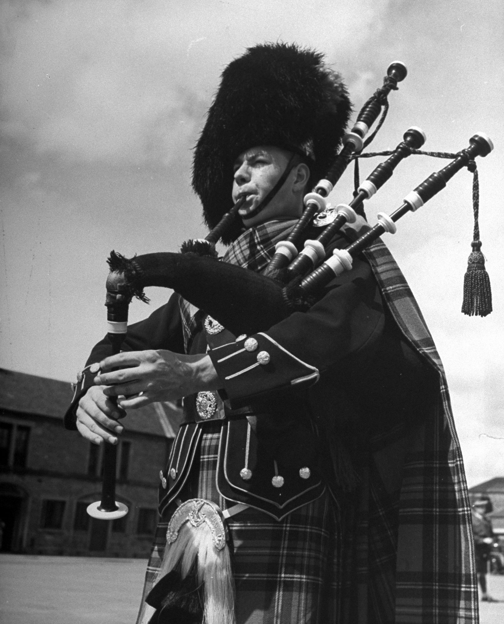 In full dress a piper of the famed Black Watch regiment pipes a pibroch at Perth Barracks.