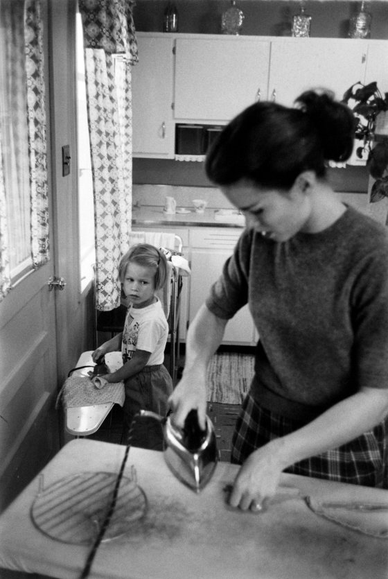 Jennie Magill ironing with her daughter.