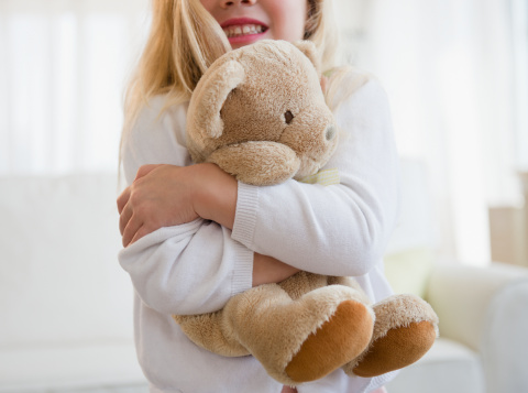 girl-hugging-teddy-bear