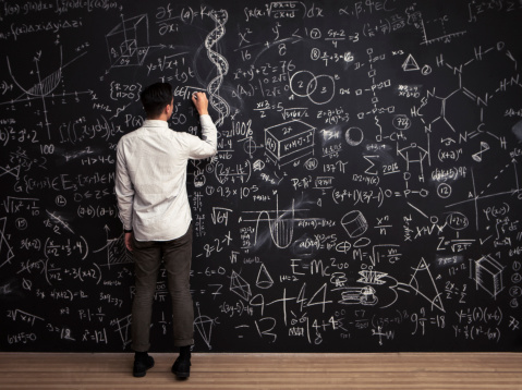 man-writing-chalkboard-math