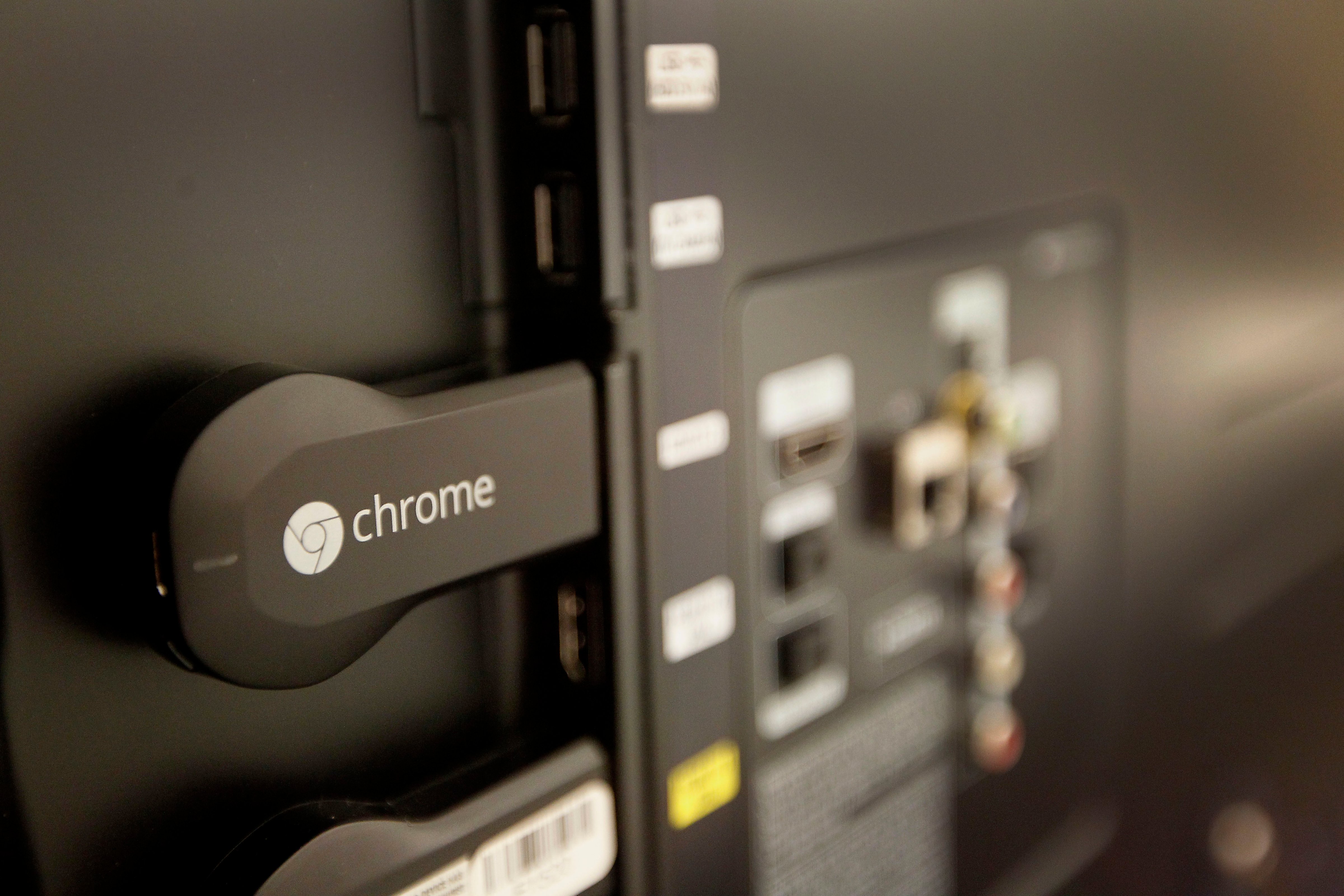 The new Google Chromecast is connected to the the back of a television during an event in San Francisco, California, U.S., on Wednesday, July 24, 2013. (Bloomberg&mdash;Bloomberg via Getty Images)