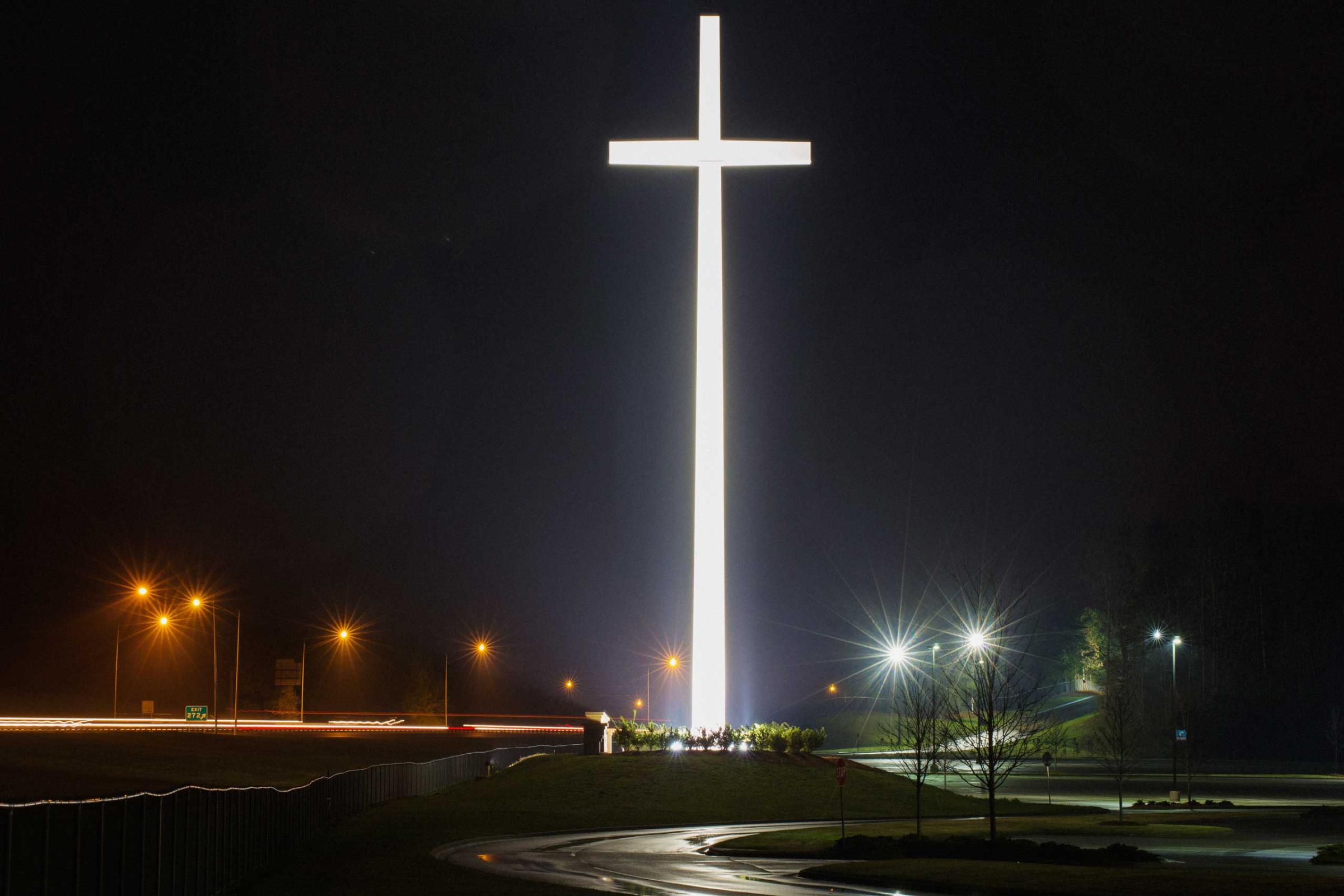 A giant cross by highway I-65 is illuminated at night, marking the site of Gardendale First Baptist Church in Gardendale, Ala. on March 21, 2015.