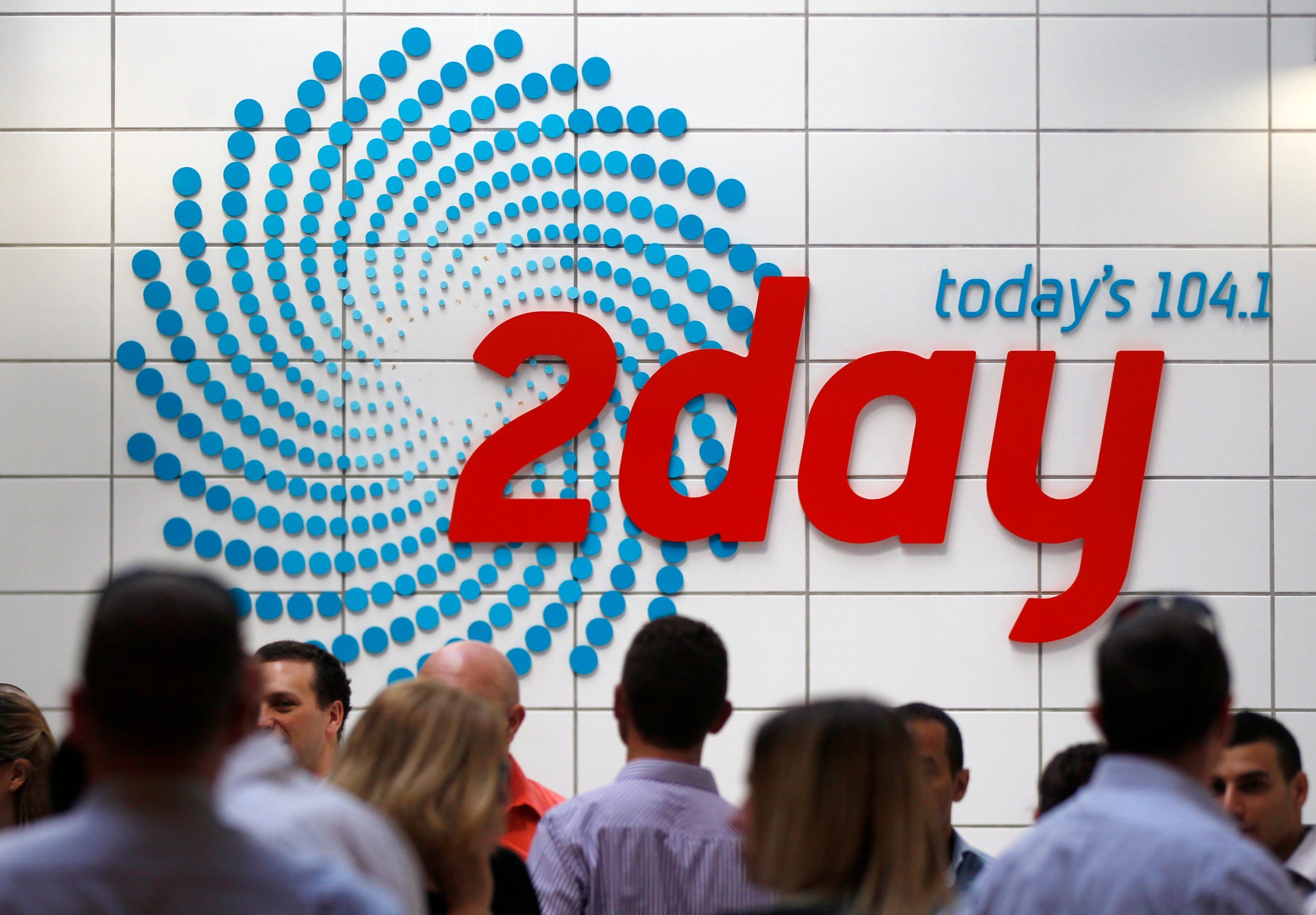 People gather in the foyer of the building that houses the 2Day FM radio station in Sydney December 6, 2012.