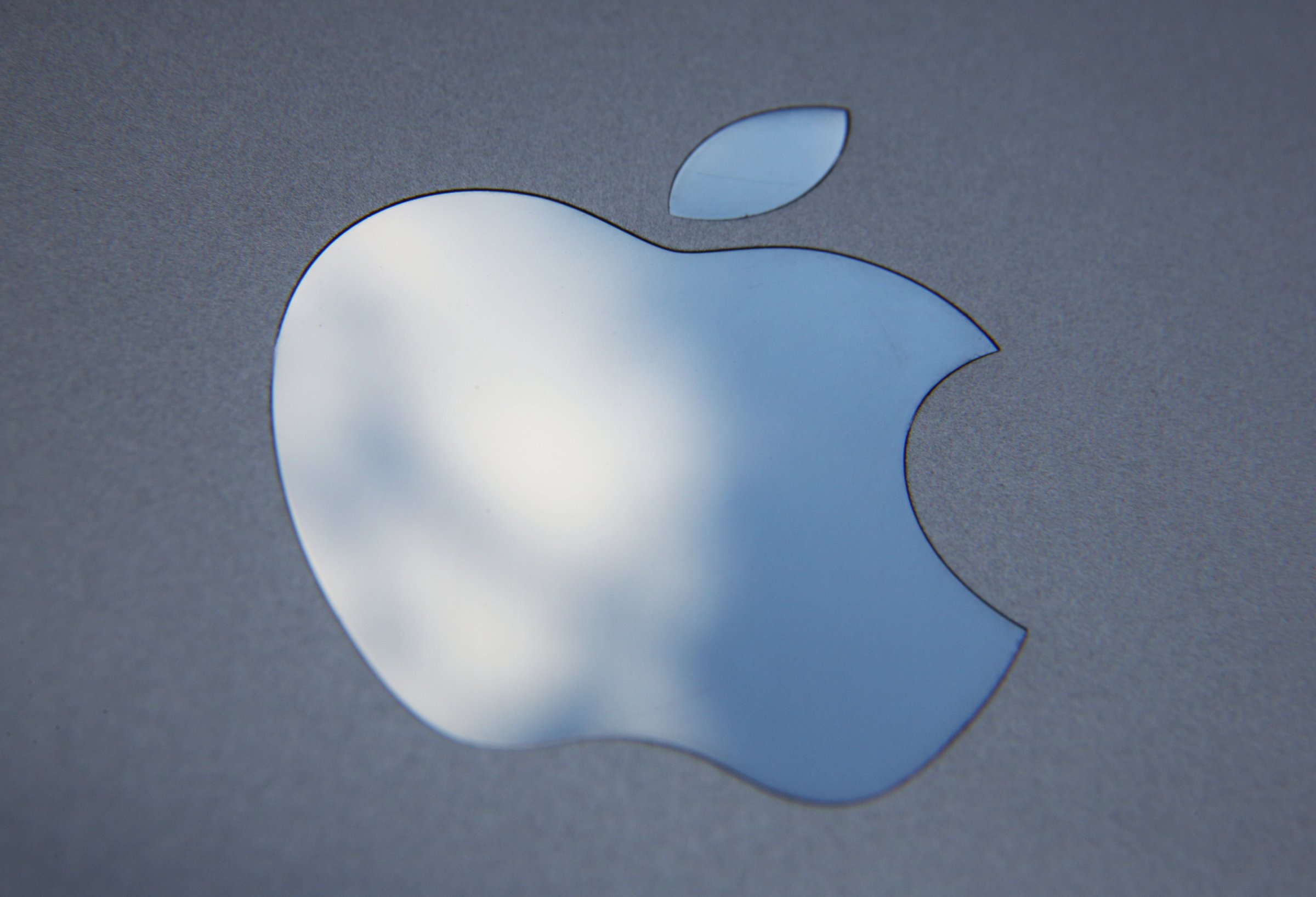 In this photo illustration the logo on an Apple iPad is seen on August 6, 2014 in London, England.