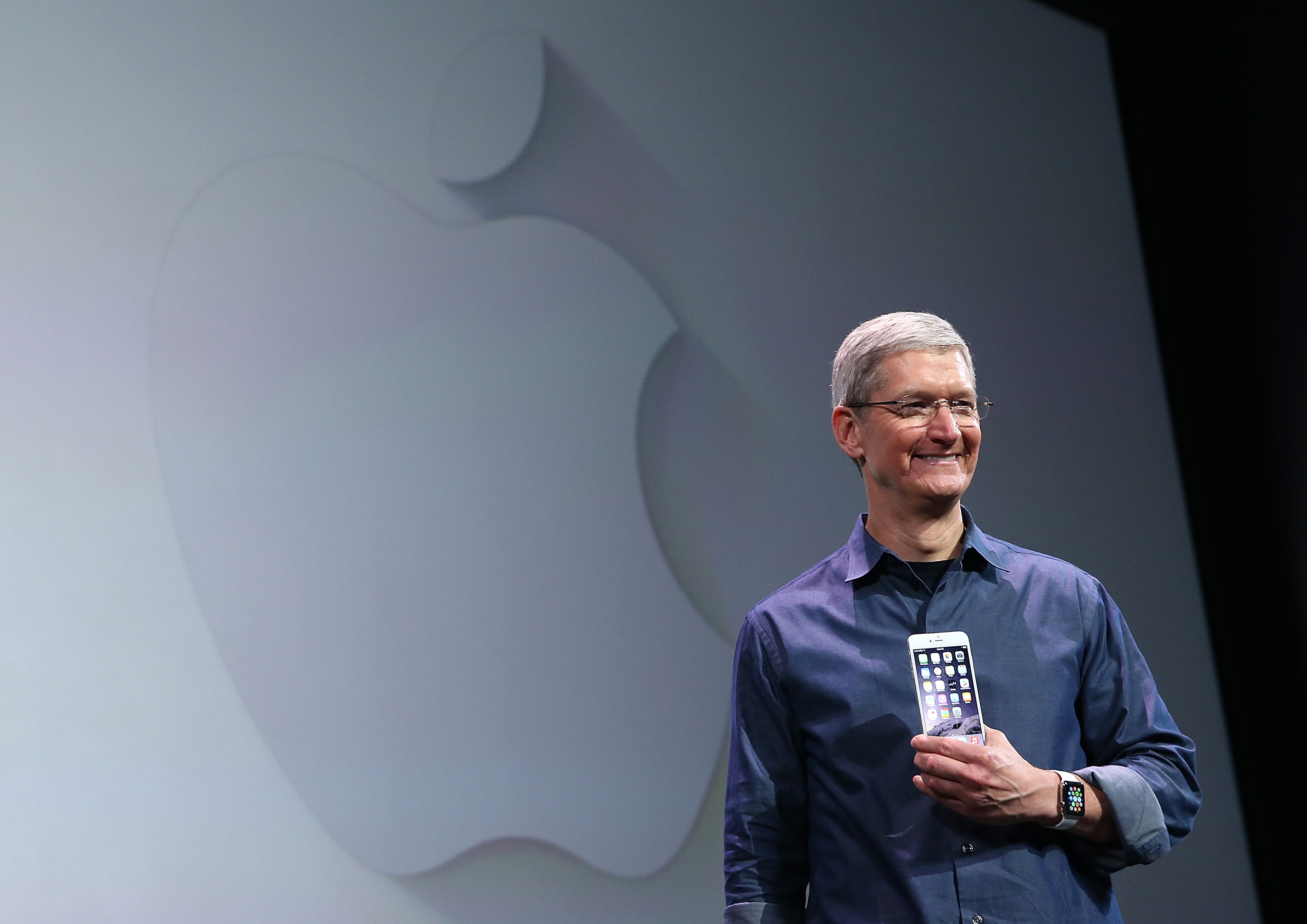 Apple CEO Tim Cook shows off the new iPhone 6 and the Apple Watch during an Apple special event at the Flint Center for the Performing Arts on September 9, 2014 in Cupertino, California. (Justin Sullivan&mdash;Getty Images)