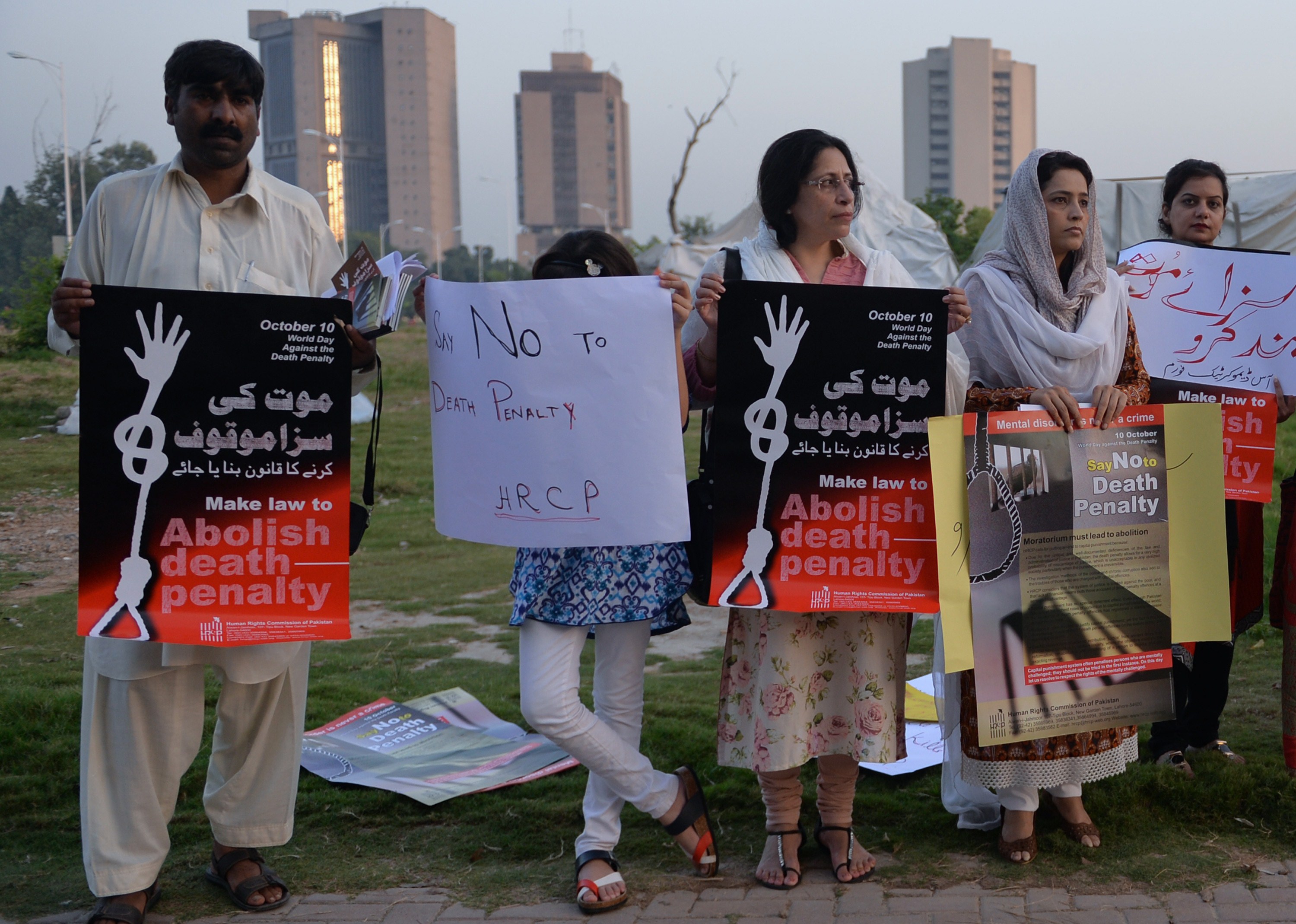 Pakistani NGO activists carry placards during a demonstration to mark the International Day Against the Death Penalty in Islamabad on October 10, 2014. (AAMIR QURESHI—AFP/Getty Images)