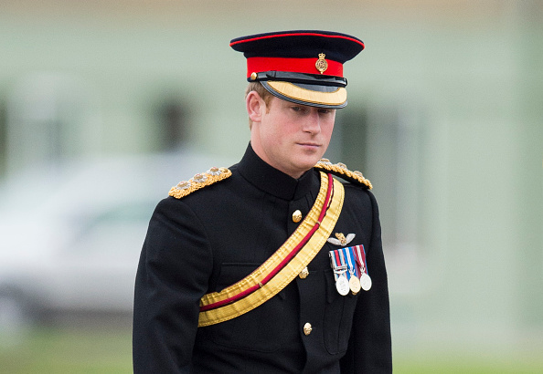 Prince Harry presents a new standard at RAF Honington in Bury St. Edmunds, England, on Nov. 13, 2014 (Mark Cuthbert—UK Press via Getty Images)