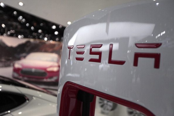 The Tesla Motors Inc. logo is seen during the 2014 North American International Auto Show (NAIAS) in Detroit on Jan. 14, 2014.