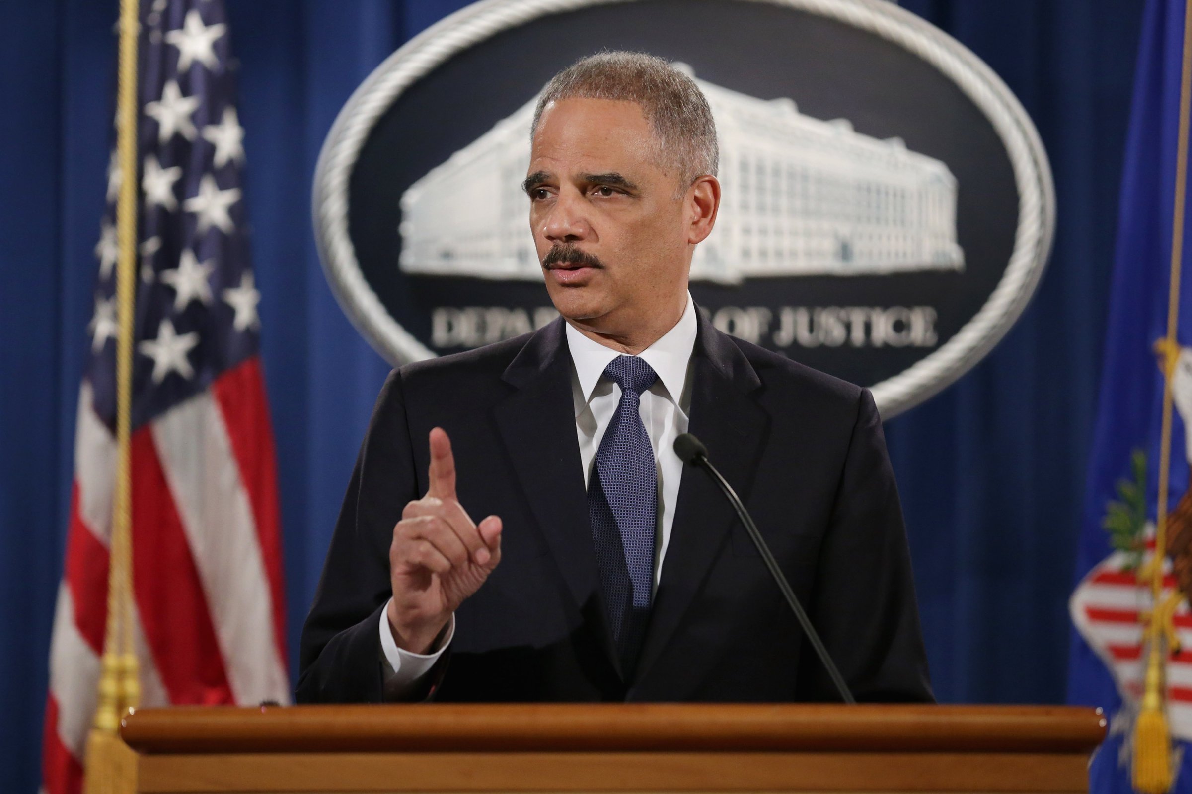Attorney General Eric Holder delivers remarks about the Justice DepartmentÕs findings related to two investigations in Ferguson, Missouri, at the Robert F. Kennedy Department of Justice Building March 4, 2015 in Washington, DC. Holder delivered the remarks for an audience of department employees who worked on the investigations after a white police officer shot and killed an unarmed black teenager, sparking weeks of demonstrations and violent clashes.