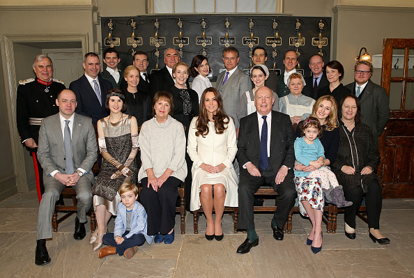 Catherine, Duchess of Cambridge (C) poses with cast, crew and producers of 'Downton Abbey' during an official visit to the set of Downton Abbey at Ealing Studios in London, England on March 12, 2015.