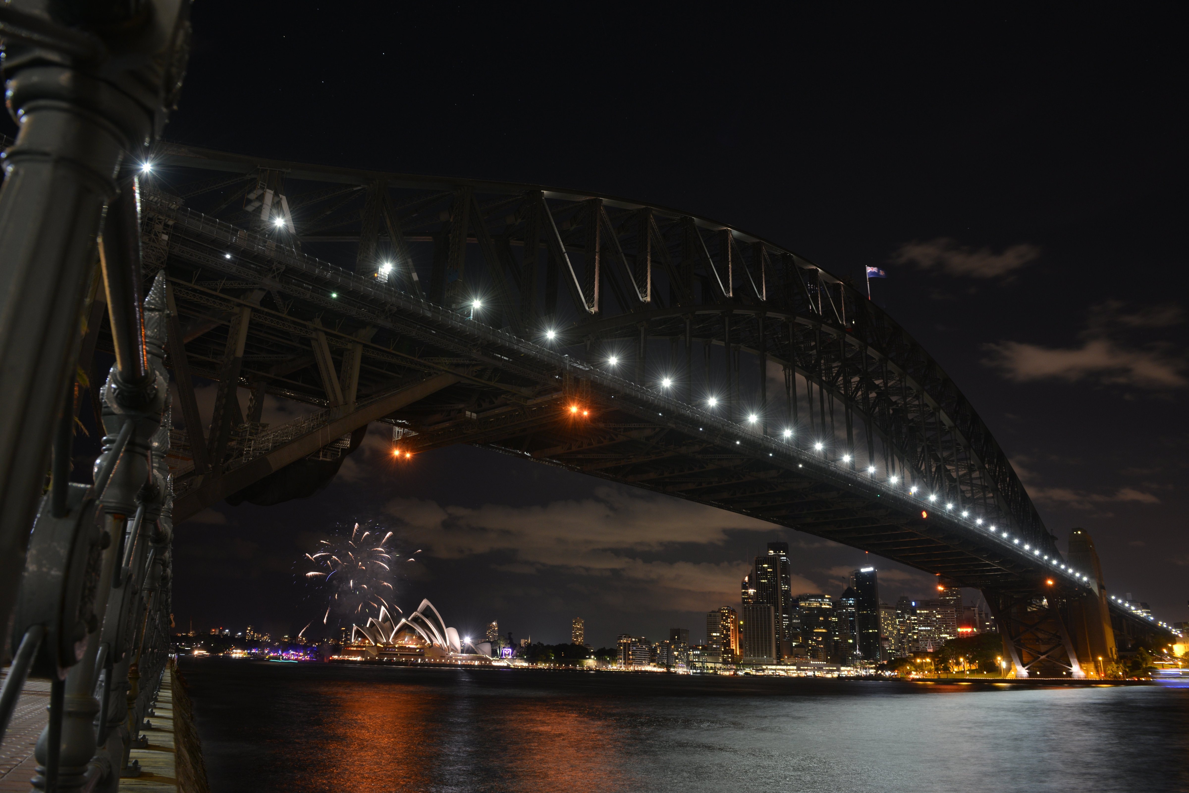 Fireworks fade as lights go out on the Sydney Harbour Bridge and Opera House to signal the start of the Earth Hour environmental campaign, among the first landmarks around the world to dim their lights for the event on March 28, 2015. (Peter Parks&mdash;AFP/Getty Images)