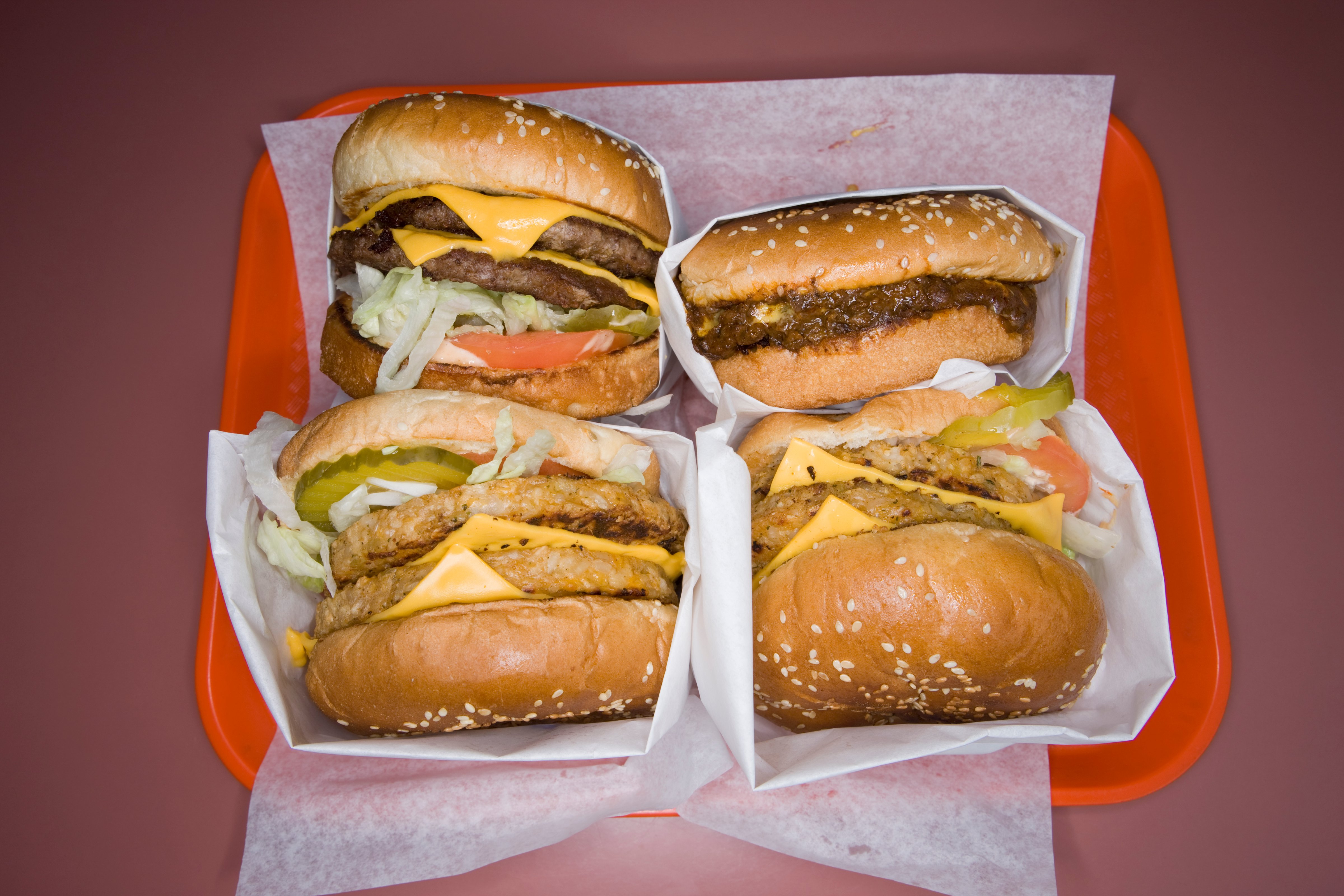 a fast food tray full of hamburgers