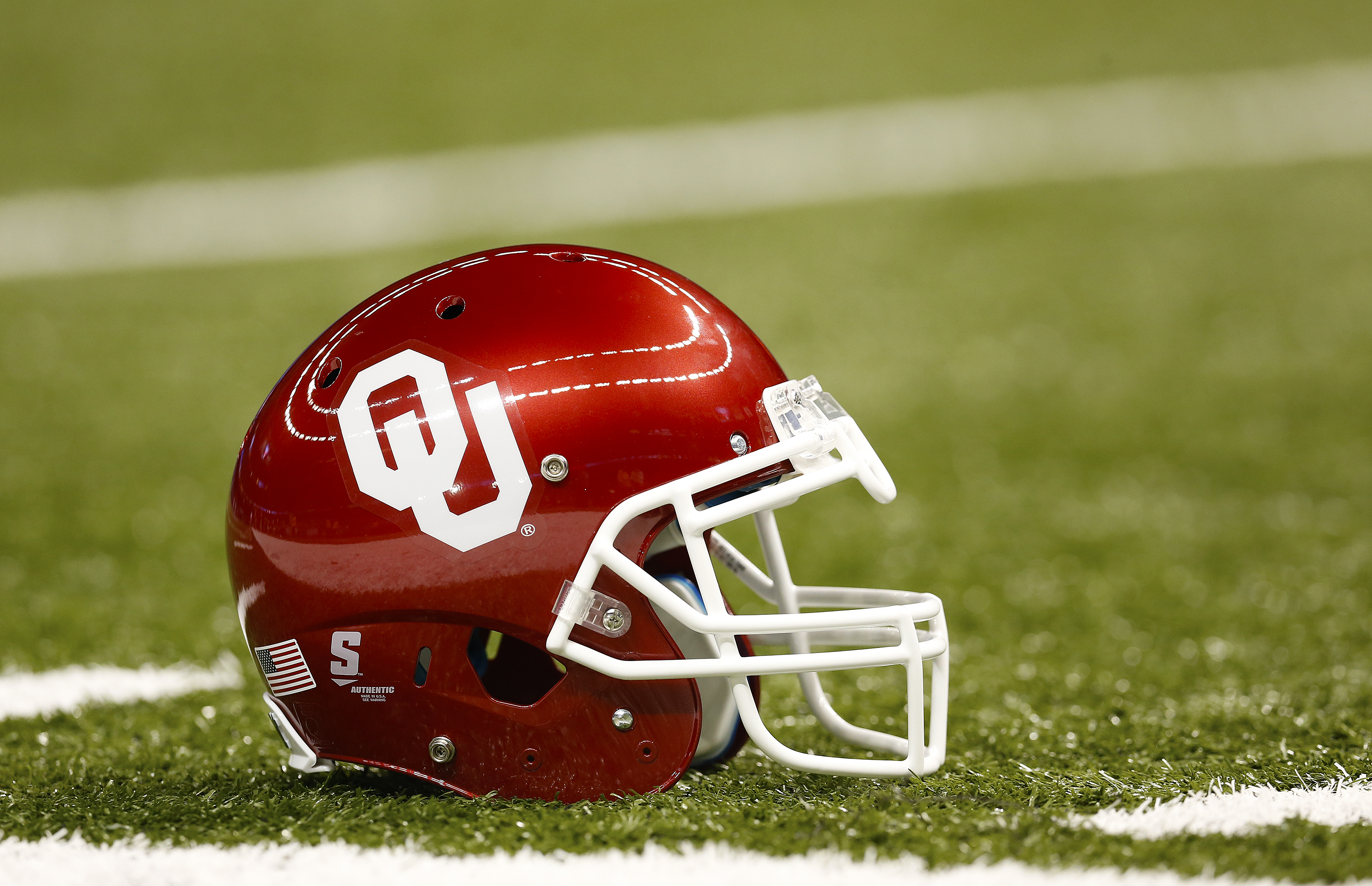 University of Oklahoma Sooners helmet is seen on the field a game against the University of Alabama Crimson Tide in New Orleans on Jan. 2, 2014. (Aaron M. Sprecher—AP)
