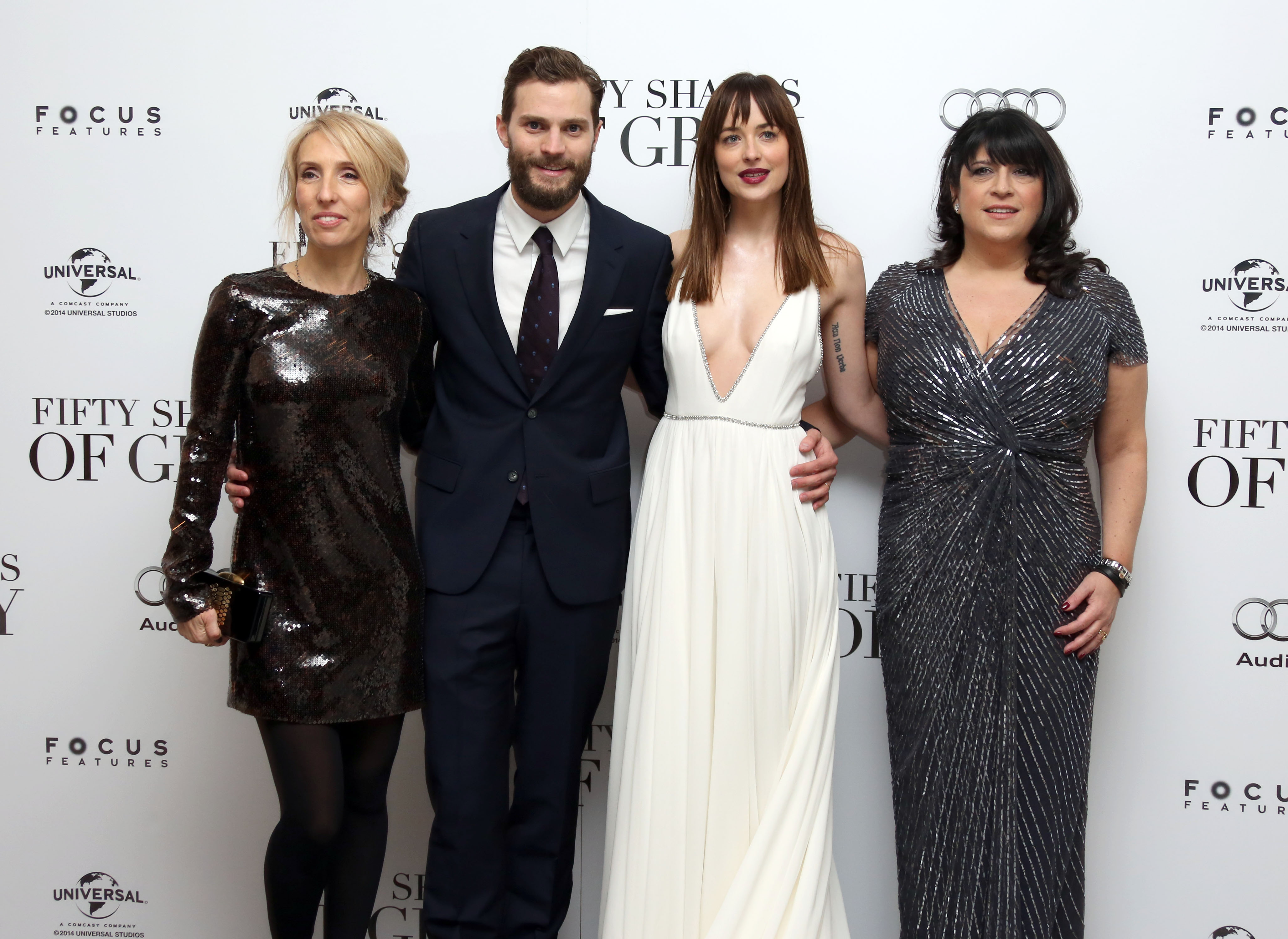 Sam Taylor-Johnson, Jamie Dornan, Dakota Johnson and E.L. James  pose for photographers upon arrival at the UK premiere of the film <i>Fifty Shades of Grey</i>
                      in London, Feb. 12, 2015 (Joel Ryan—Invision/AP)