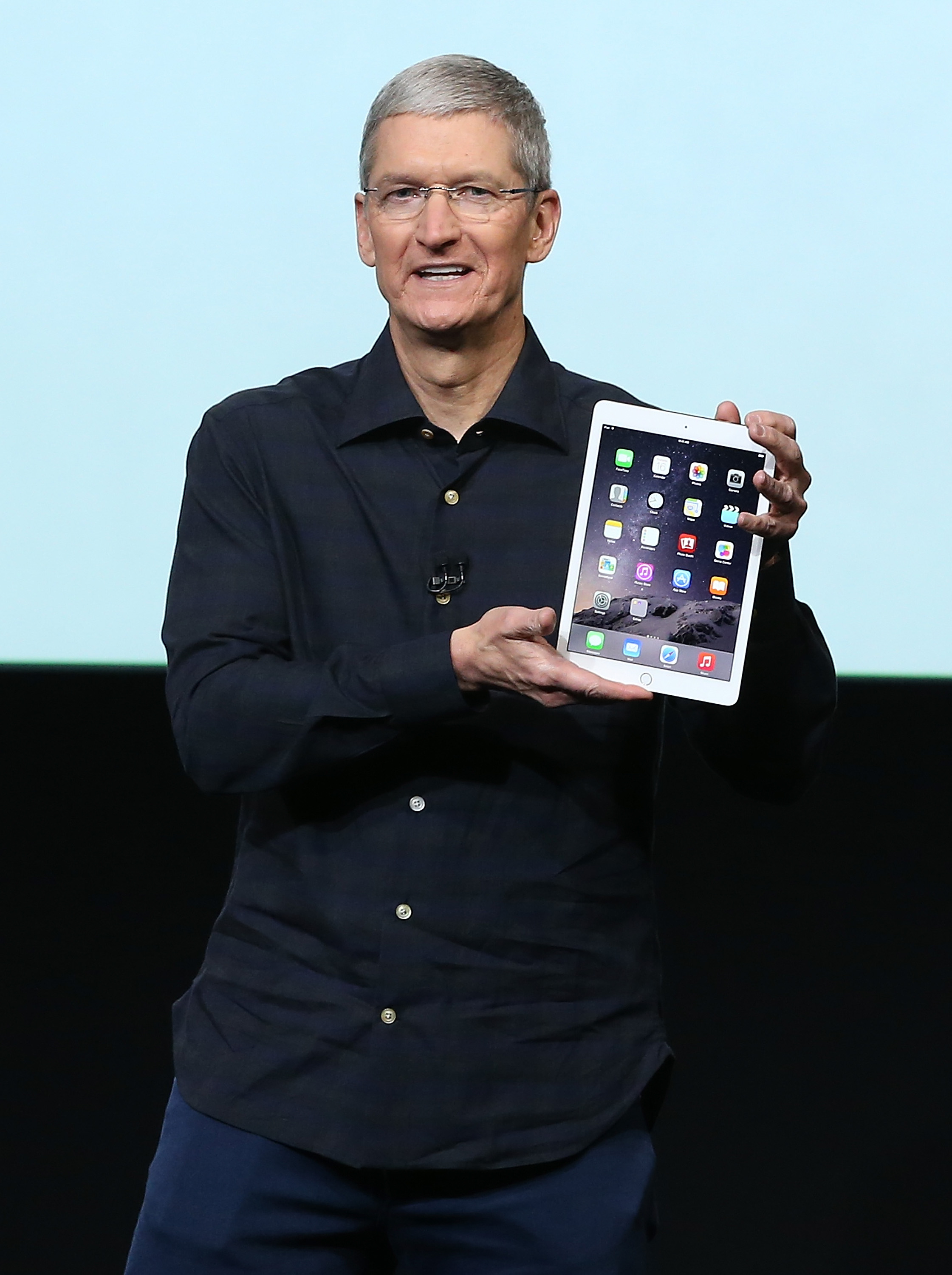 Apple CEO Tim Cook holds the new iPad Air 2 during a special event on Oct. 16, 2014 in Cupertino, Calif. (Justin Sullivan&mdash;Getty Images)