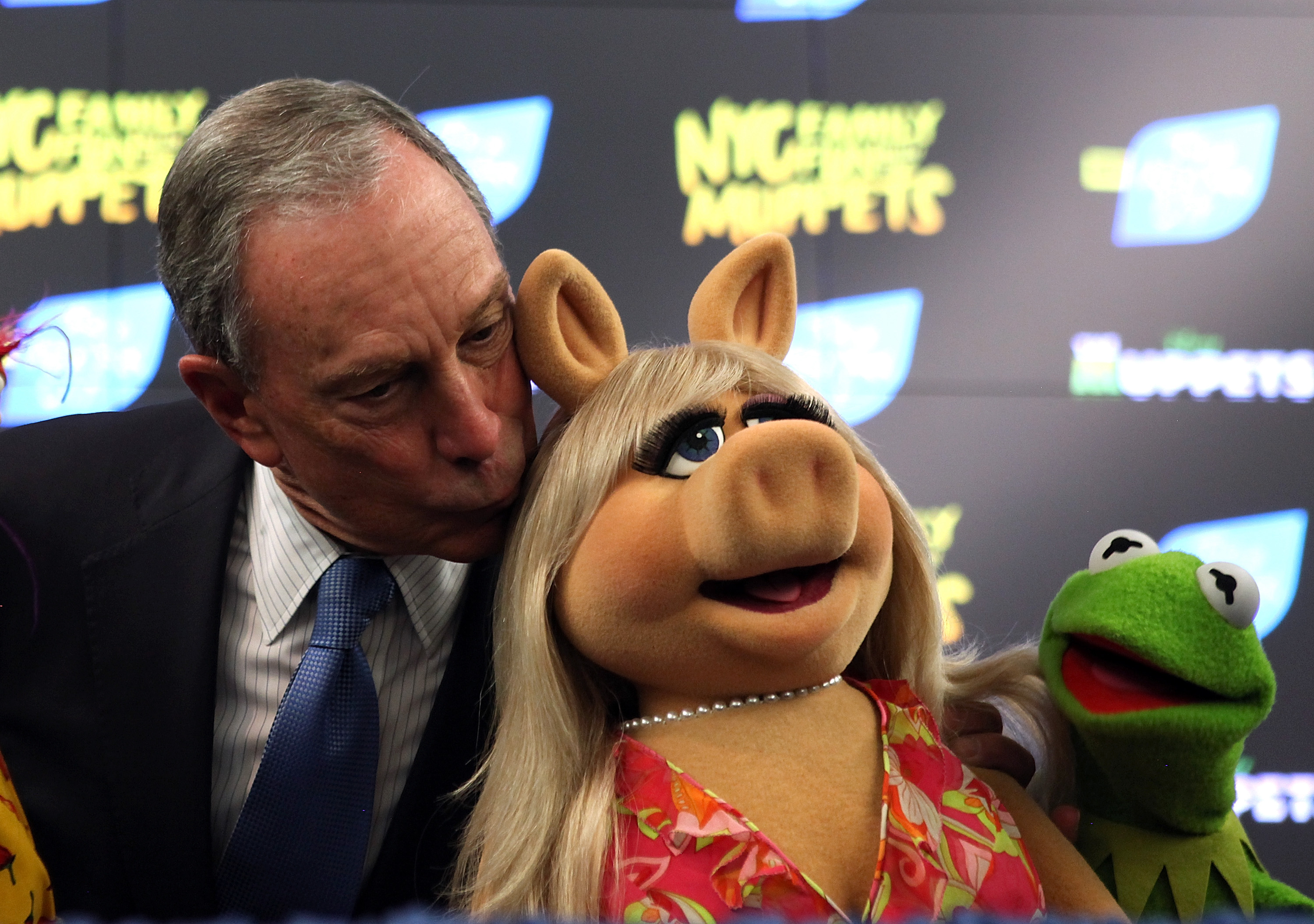 New York City Mayor Michael Bloomberg kisses Muppet Miss Piggy as Kermit the Frog looks on during a news conference on April 13, 2012 in New York City.