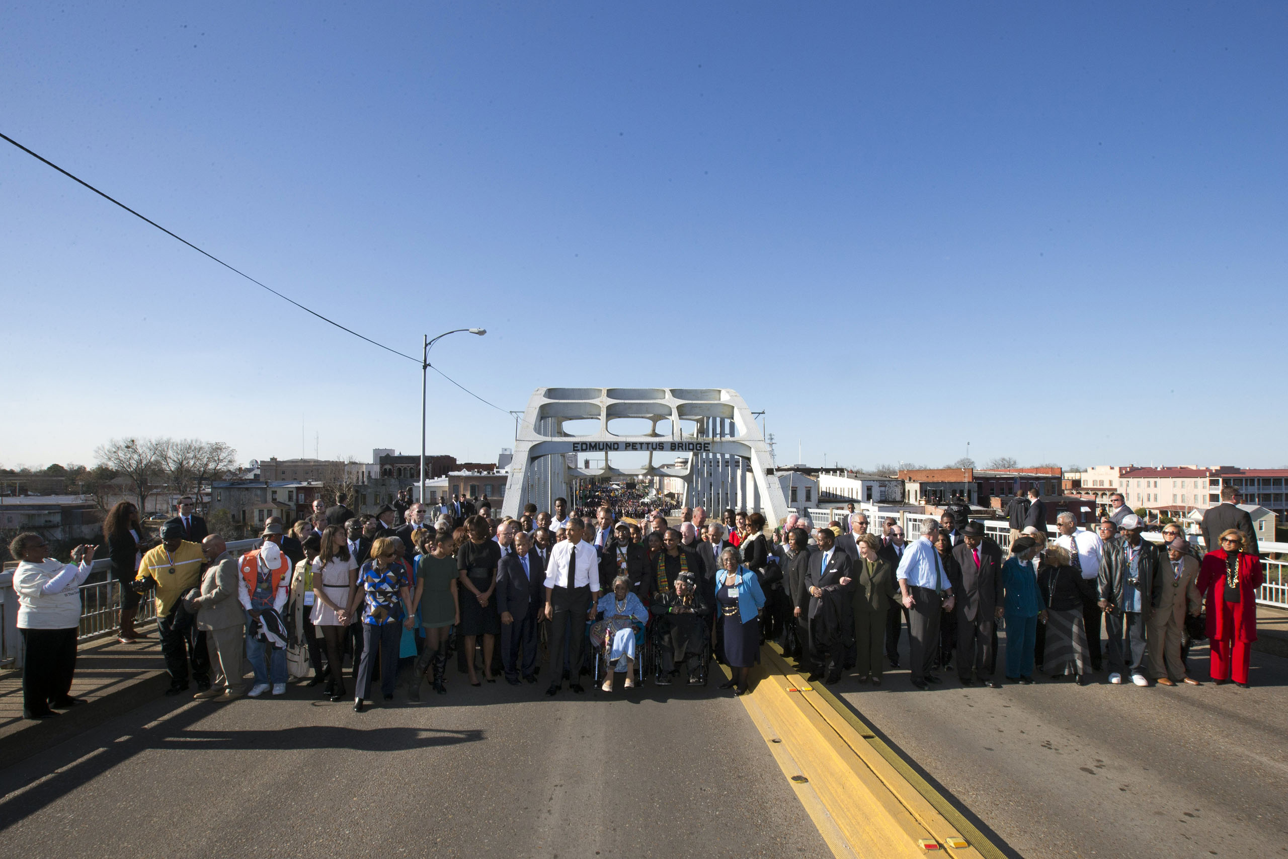 President Barack Obama, first lady Michelle Obama, their daughters Malia and Sasha, as well as members of Congress and civil rights leaders make a symbolic walk across the Edmund Pettus Bridge in Selma, Ala. on March 7, 2015. (Jacquelyn Martin—AP)
