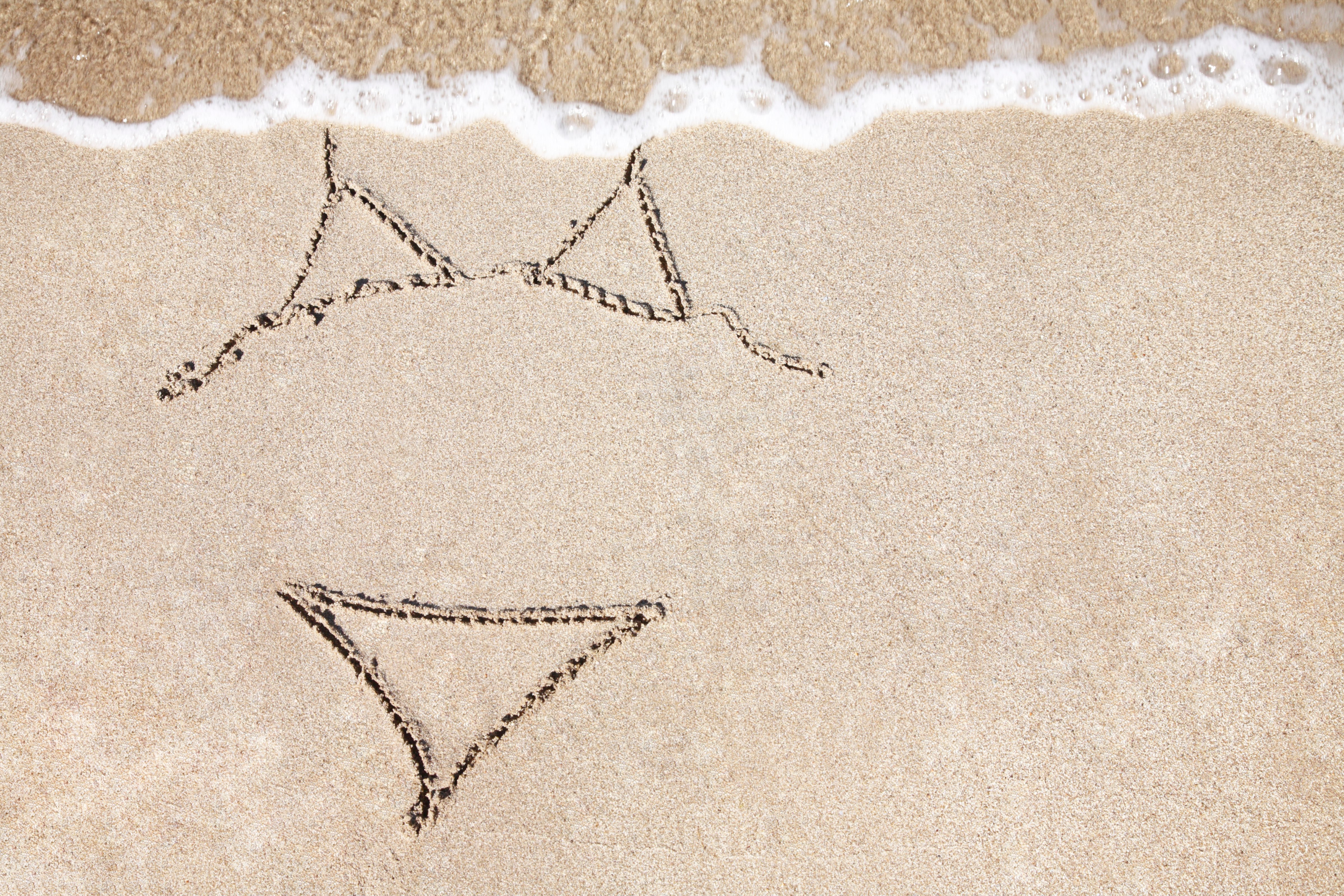 Illustration of a Bikini on sandy beach