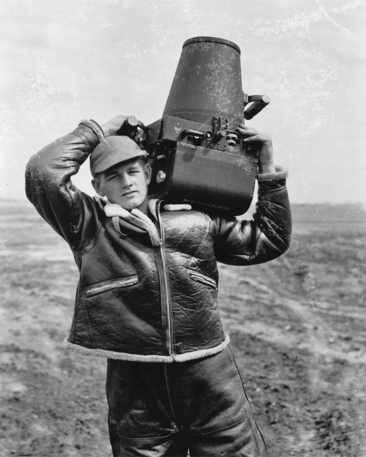 Bill Groethe holds a camera during his time as a photographer for the Army Air Corps in WWII. (Courtesy of Bill Groethe)