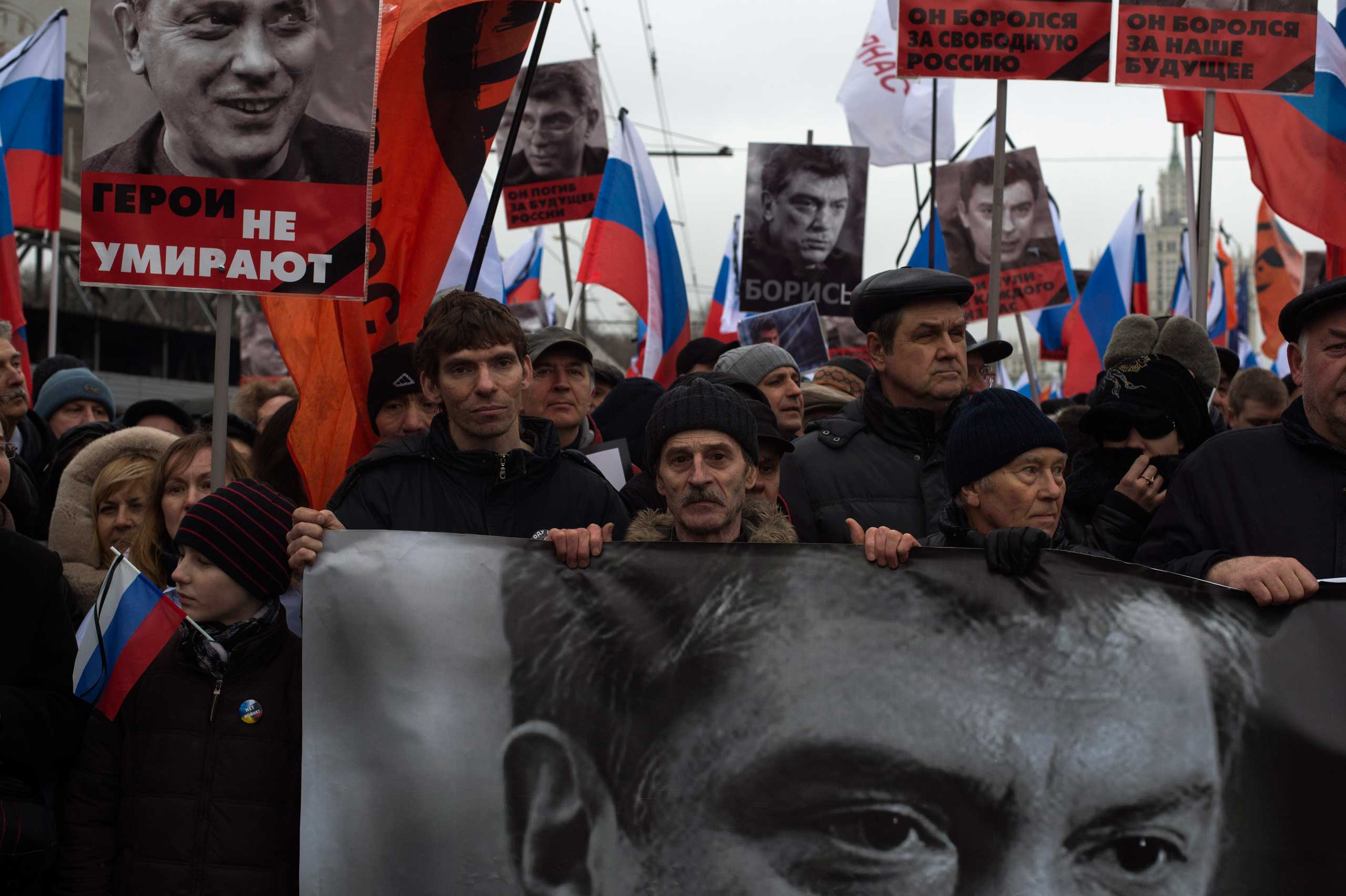 People march in memory of opposition leader Boris Nemtsov near the Kremlin in Moscow on March 1, 2015.