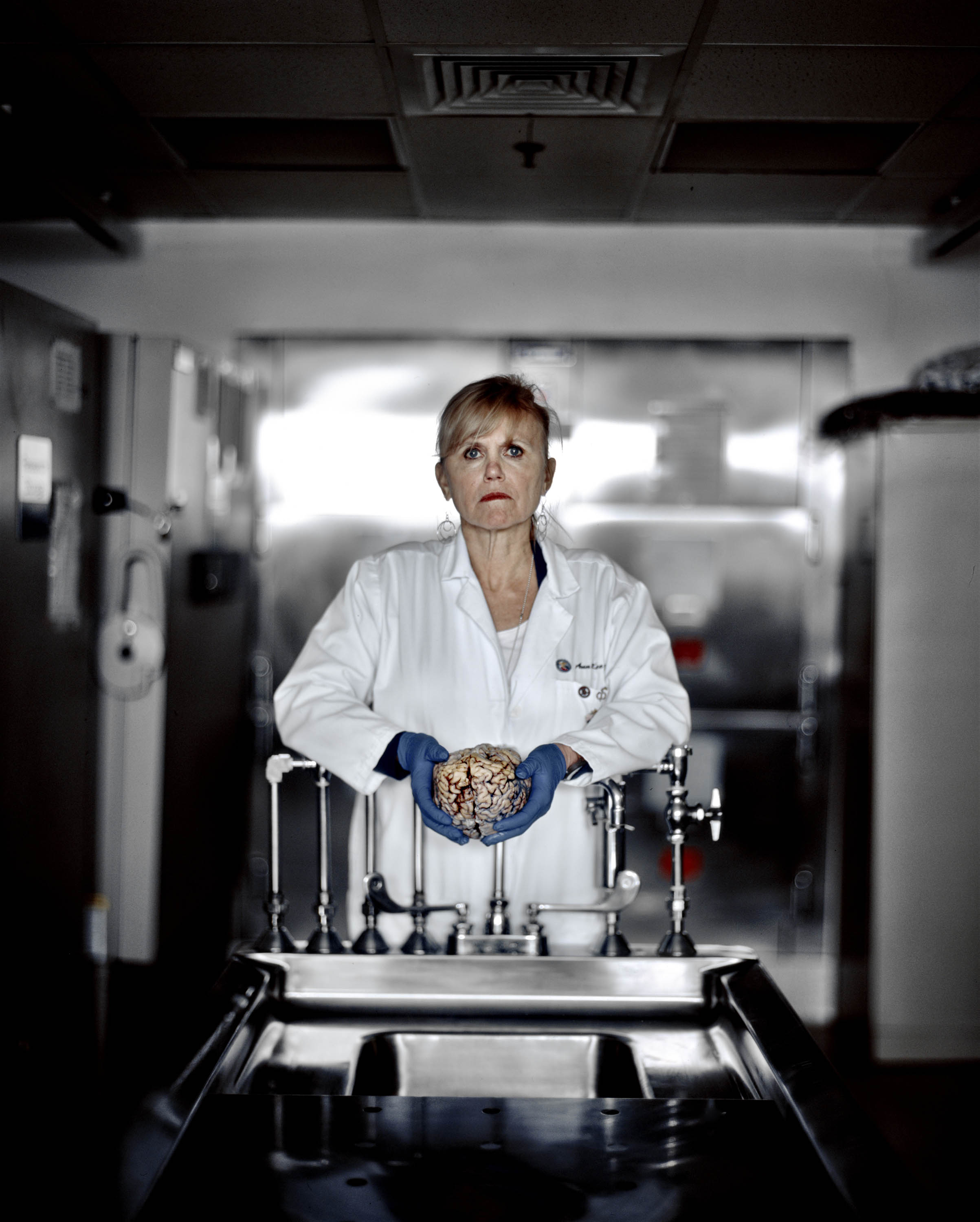 Dr. Ann McKee holds a research sample at a VA-hospital brain repository in Bedford, Mass. (Max Aguilera-Hellweg for TIME)