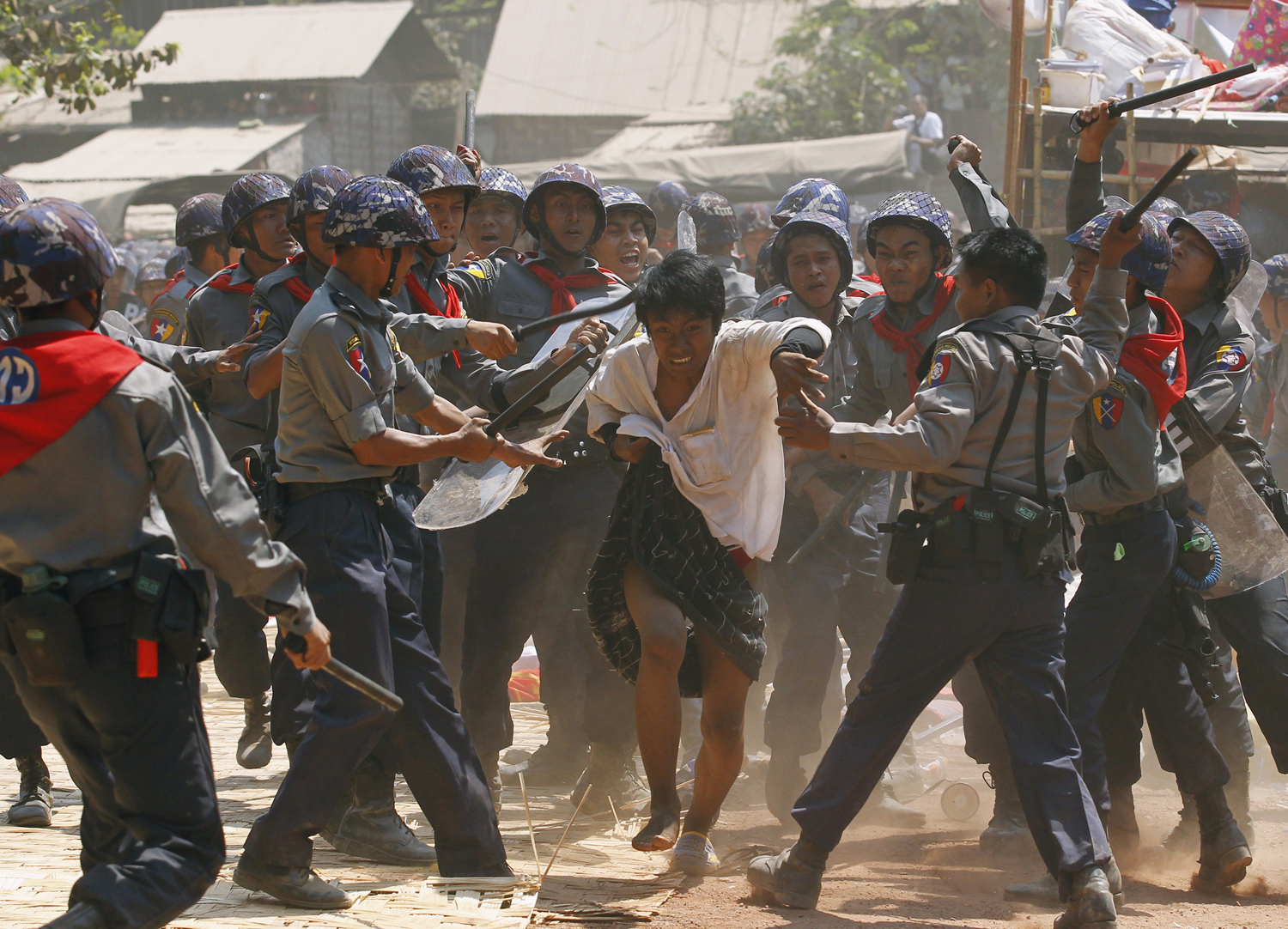 Police assault a student protester in Letpadan, Burma on March 10, 2015. (Soe Zeya Tun  — Reuters)