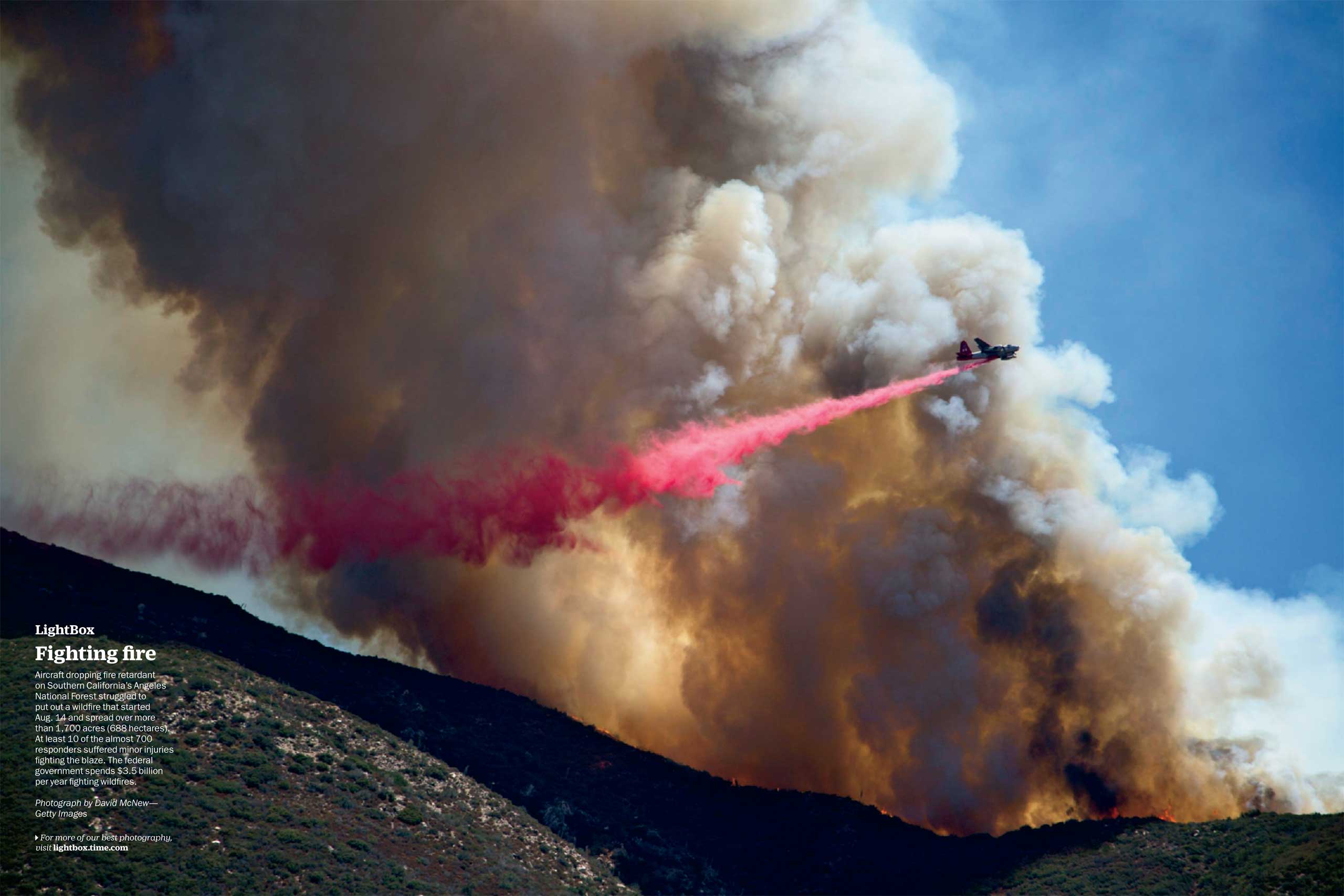 Photograph by David McNew--Getty ImagesAircraft dropping fire retardant on Southern California's Angeles National Forest struggled to put out a wildfire that started Aug. 14 and spread over more than 1,700 acres (688 hectares). At least 10 of the almost 700 responders suffered minor injuries fighting the blaze. The federal government spends $3.5 billion per year fighting wildfires. (TIME issue August 31, 2015)