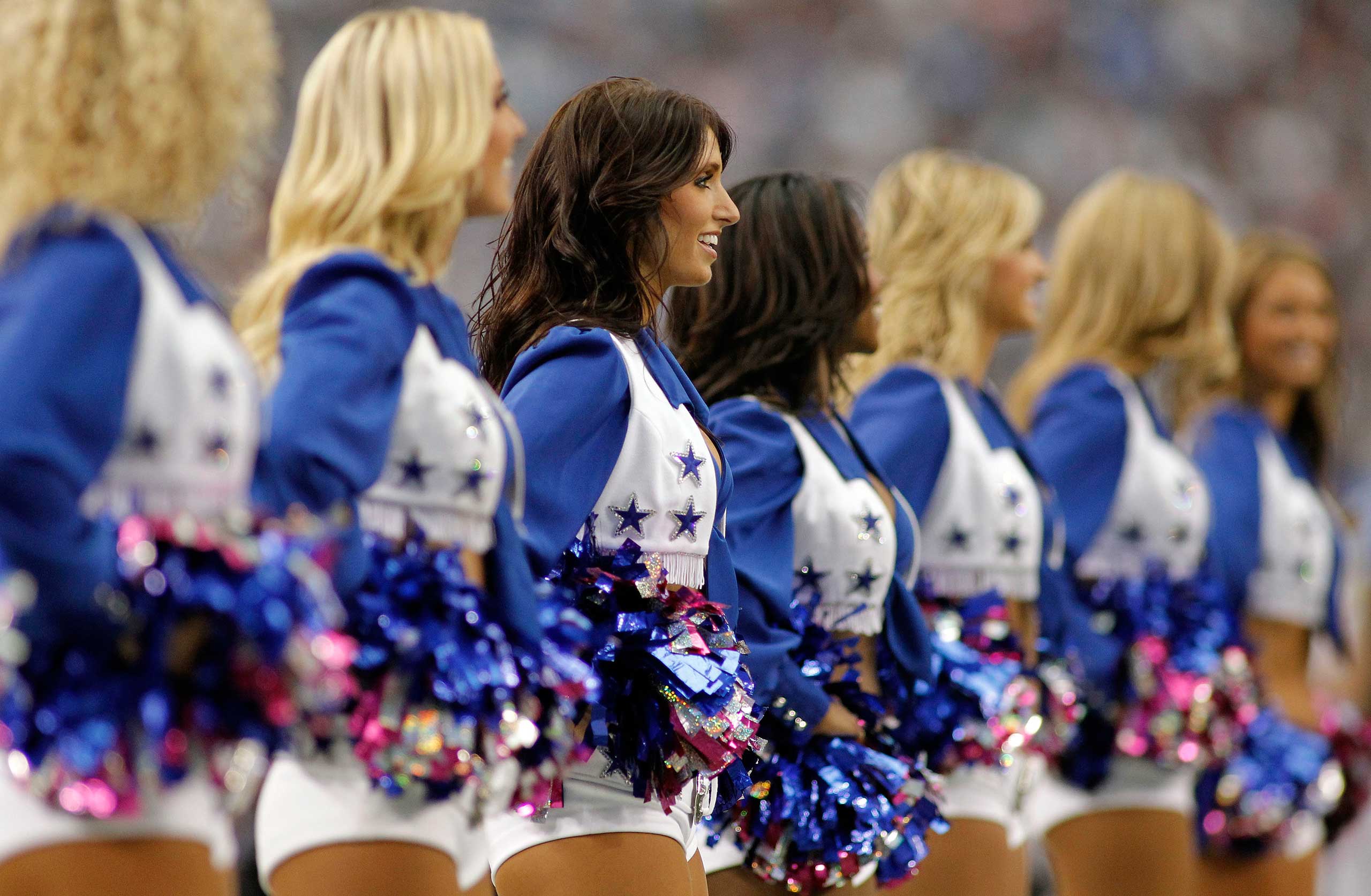 The Dallas Cowboys cheerleaders perform during the game between the Cowboys and Detroit Lions at Cowboys Stadium in Arlington, Texas. (Paul Moseley — MCT/Getty Images)