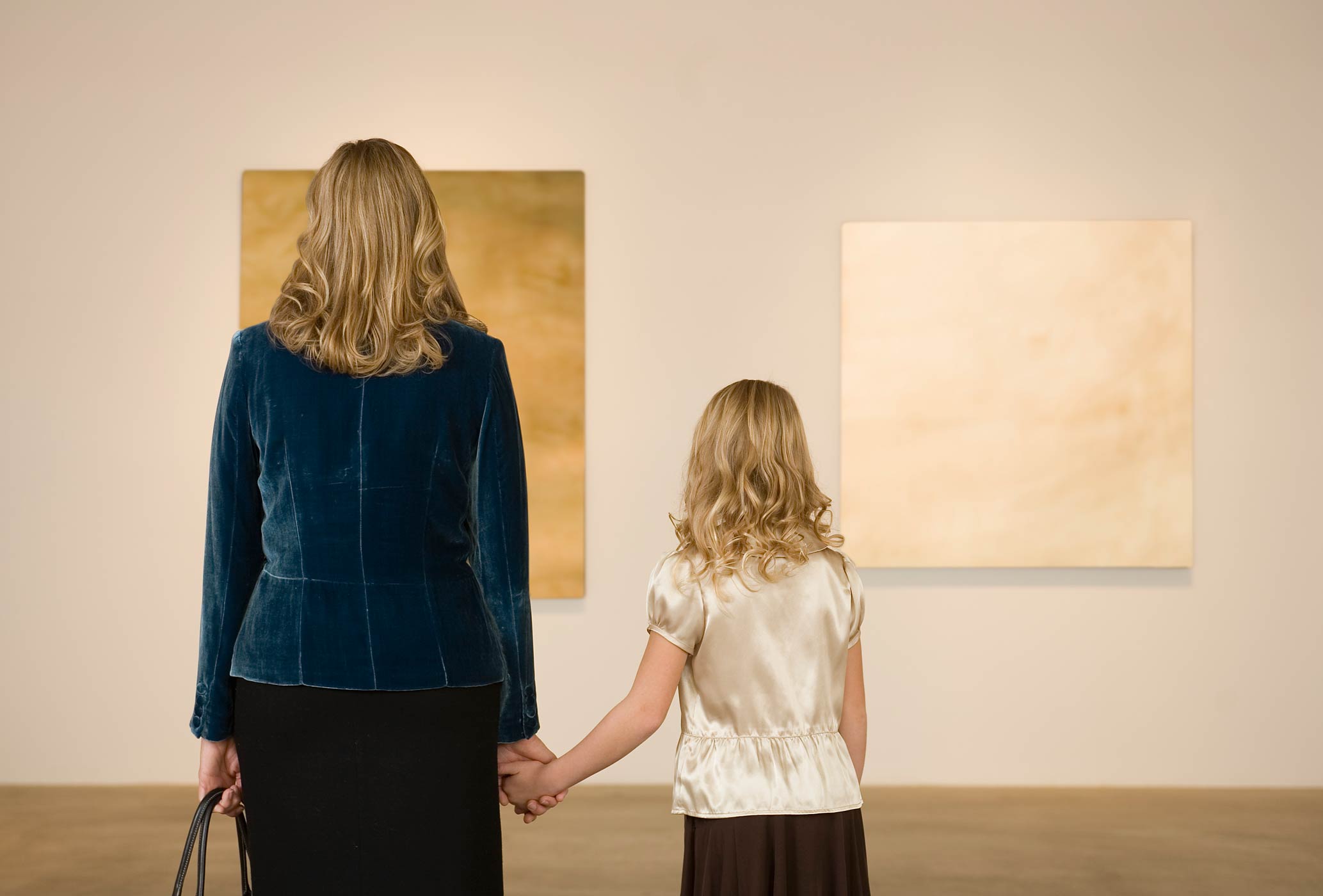 Mother and daughter in art gallery