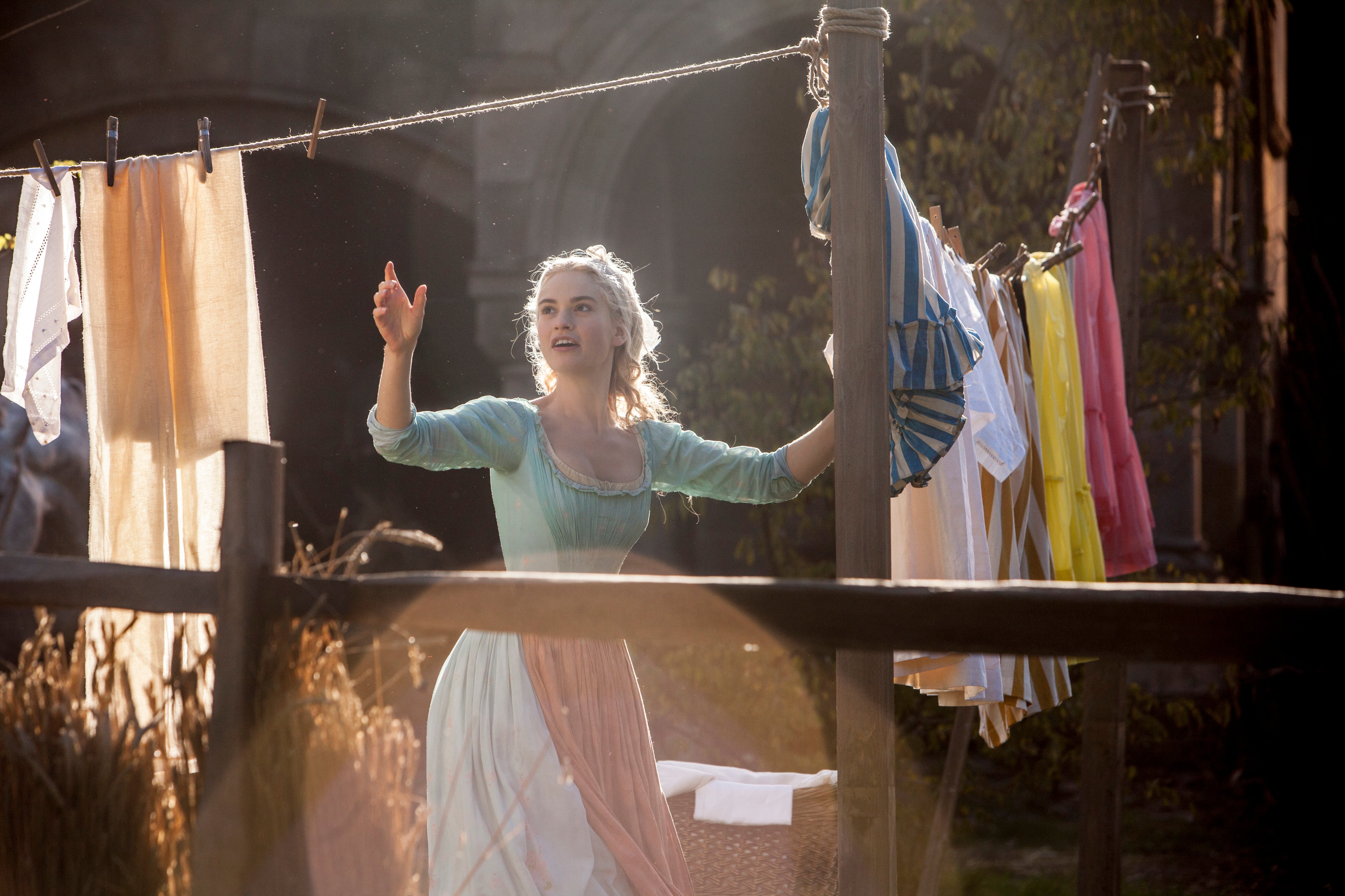 Lily James as Cinderella in Disney's 2015 live-action feature inspired by the classic fairy tale, <i>Cinderella</i> (Disney)