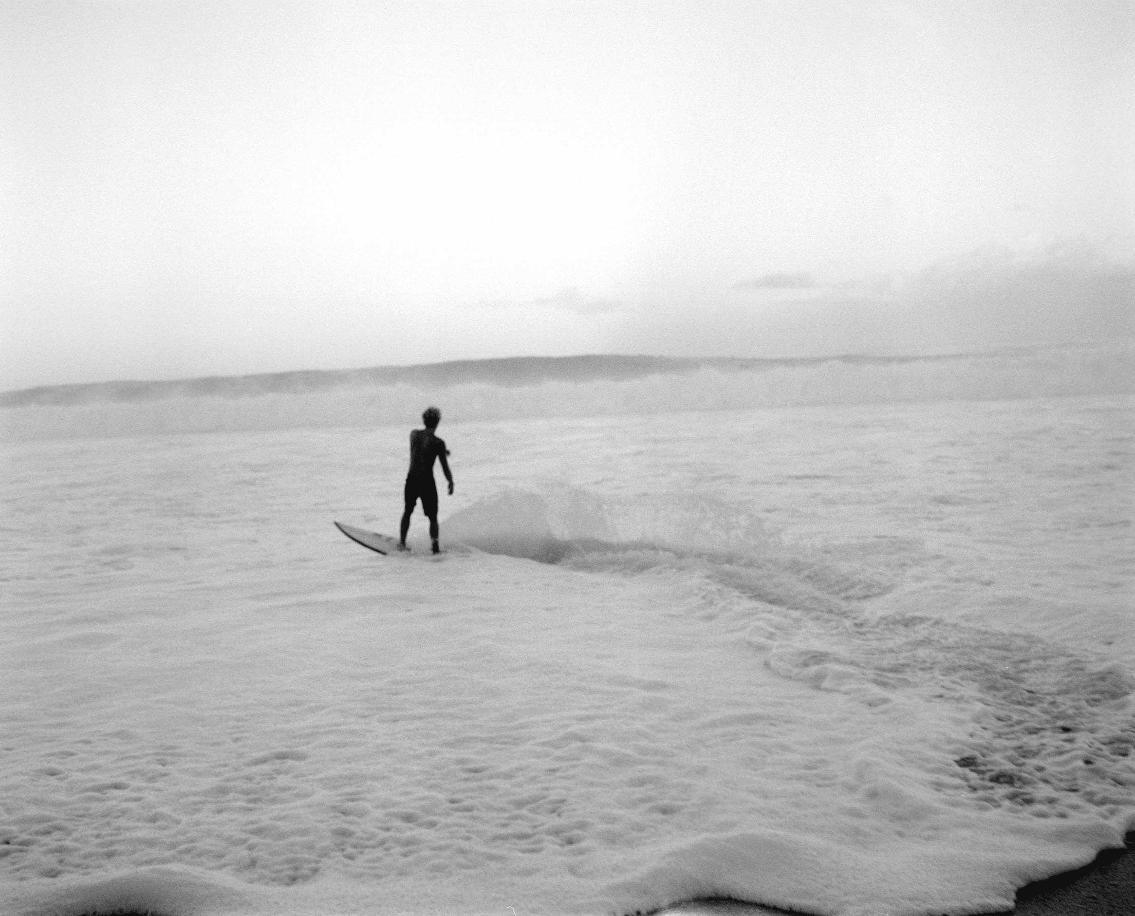 Professional surfer John John Florence, first light at dawn, on Oahu’s North Shore. Hawaii