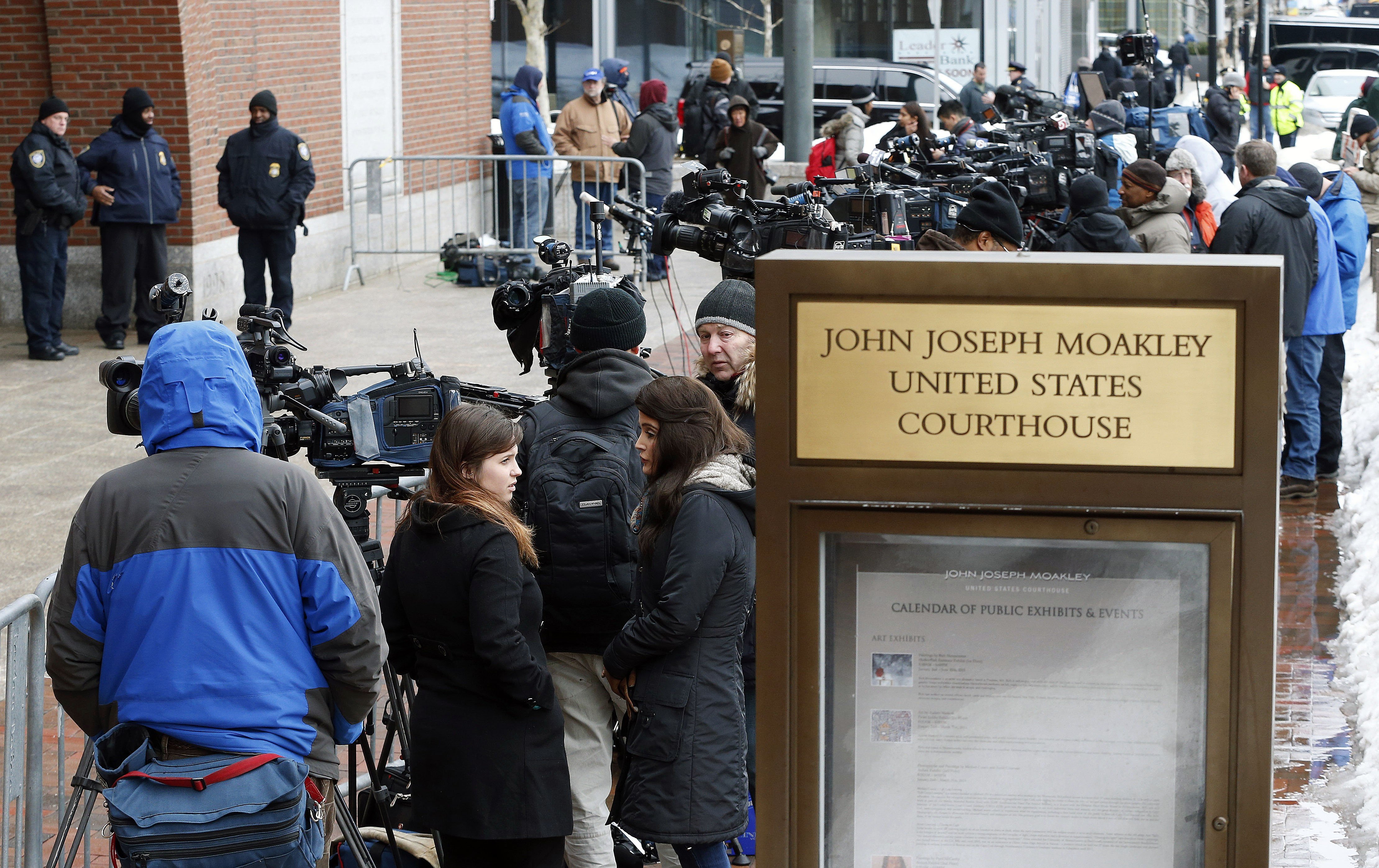 Members of the media wait outside federal court on March 4, 2015 in Boston. (Michael Dwyer—AP)