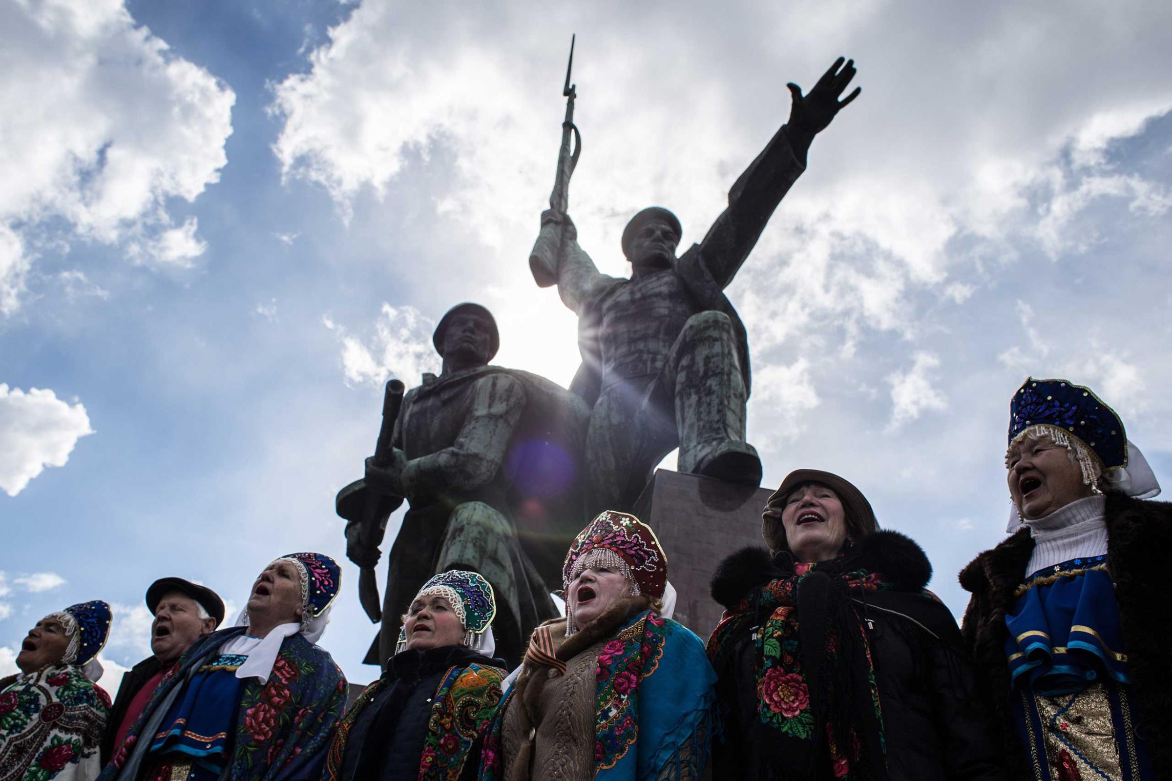 People sing on the first anniversary of the annexation to Russia, March 18, 2015 in Sevastopol.