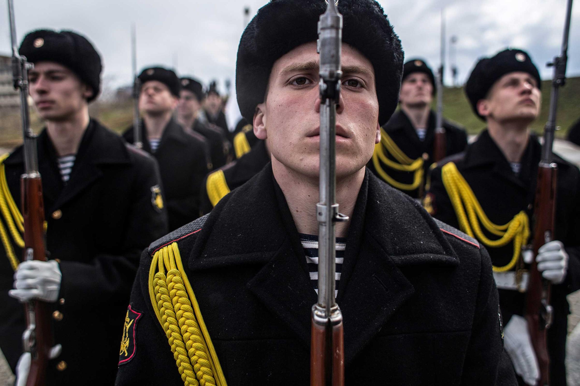 Soldiers of the honor guard prepare to march as people celebrate the first anniversary of the signing of the decree on the annexation of the Crimea by the Russian Federation, on March 18, 2014 in Sevastopol, Crimea.