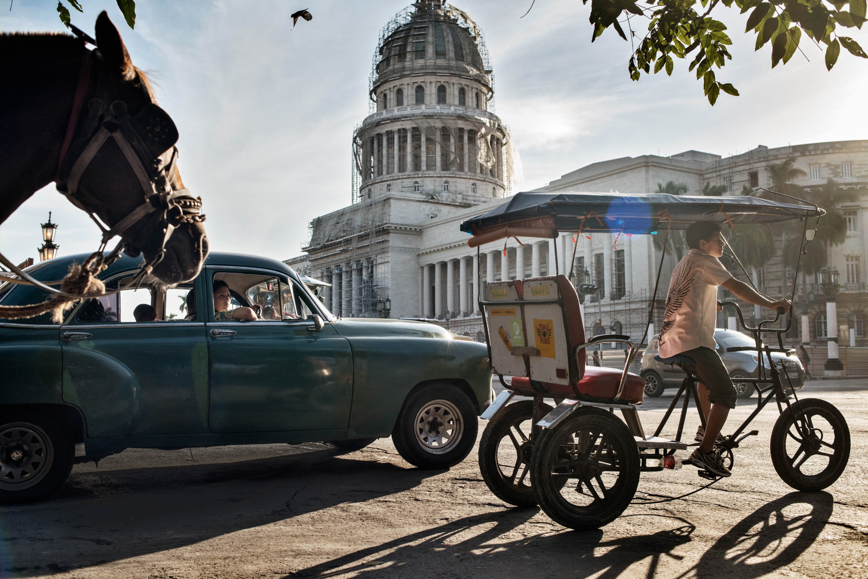 Havana is divided between new and old by the stately boulevard that runs past El Capitolio, inspired by the U.S. Capitol building. (Yuri Kozyrev—NOOR for TIME)