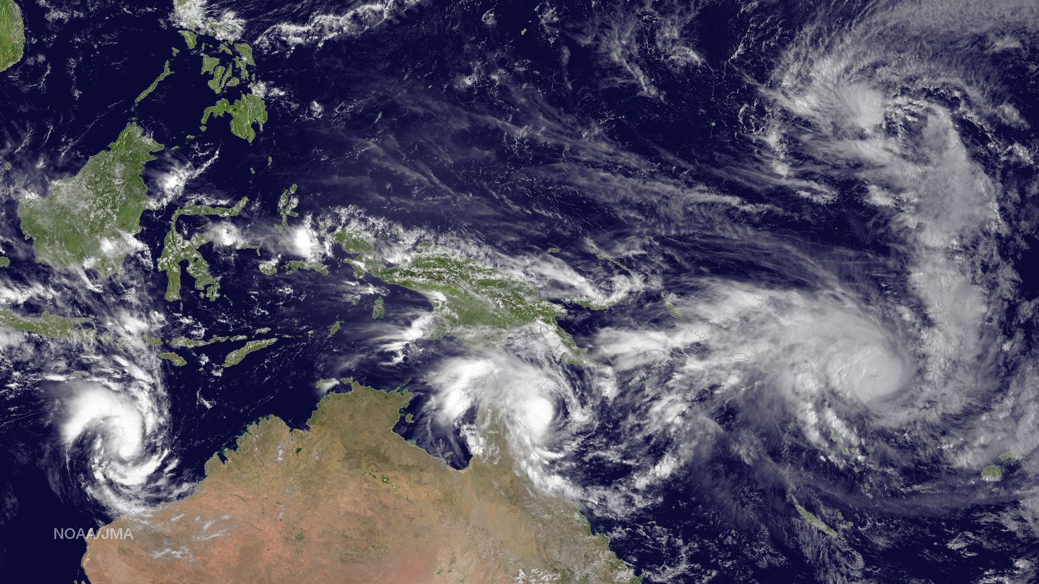 Left to right: Tropical Cyclone Olwyn in the Indian Ocean heading south for landfall near Learmonth on the west coast of Australia, Tropical Cyclone Nathan meanders northeast of Cooktown, Queensland, Australia in the Coral Sea, Tropical Cyclone Pam tracks due south heading for the islands of Vanuatu in the southern Pacific Ocean and Tropical Depression 3 heads west-northwest towards Guam in the northern Pacific Ocean on March 11, 2015.
