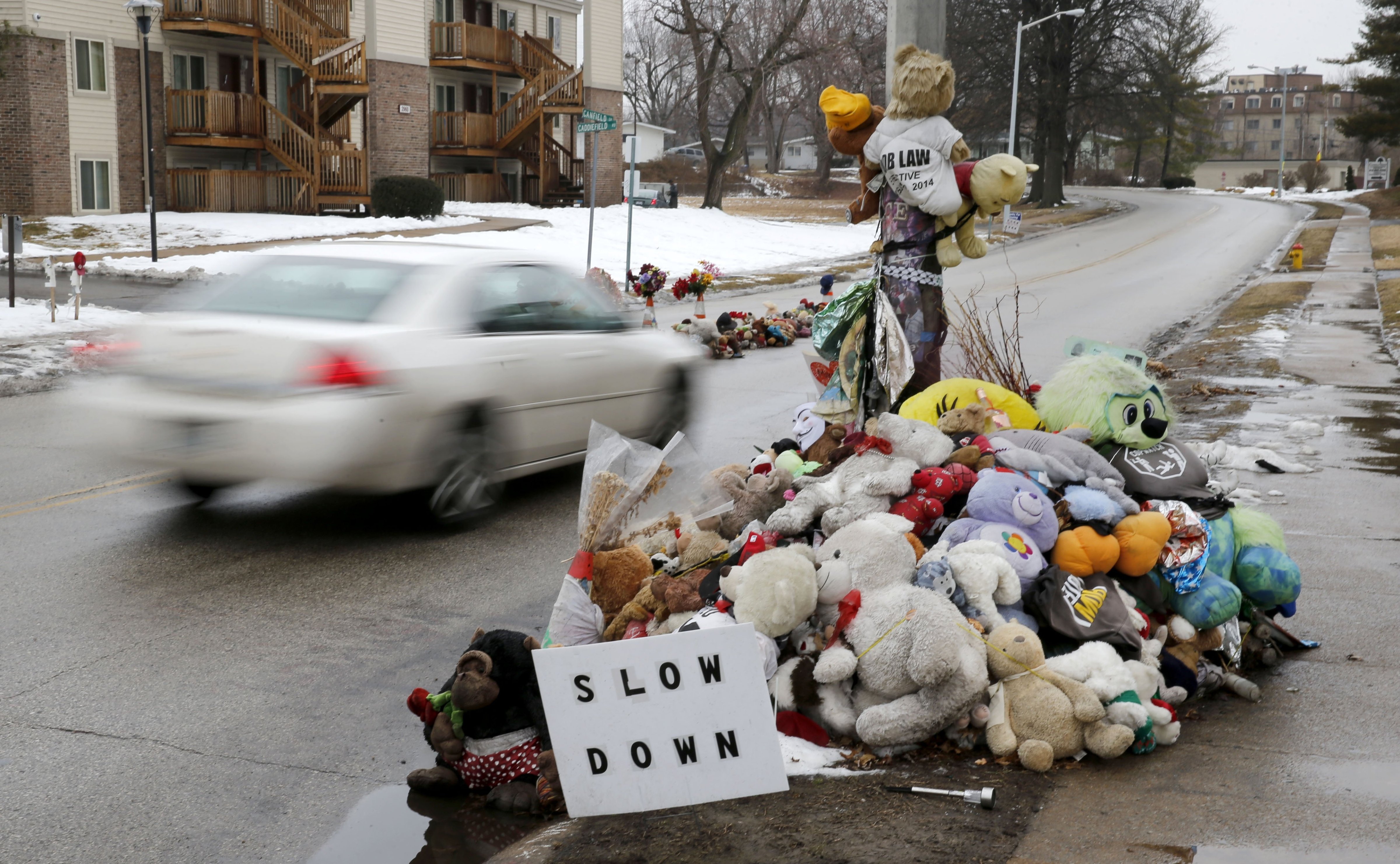 A car passes a memorial for Michael Brown, who was shot and killed by Ferguson, Mo., Police Officer Darren Wilson last summer, March 3, 2015, in Ferguson, Mo. (Charles Rex Arbogast—AP)