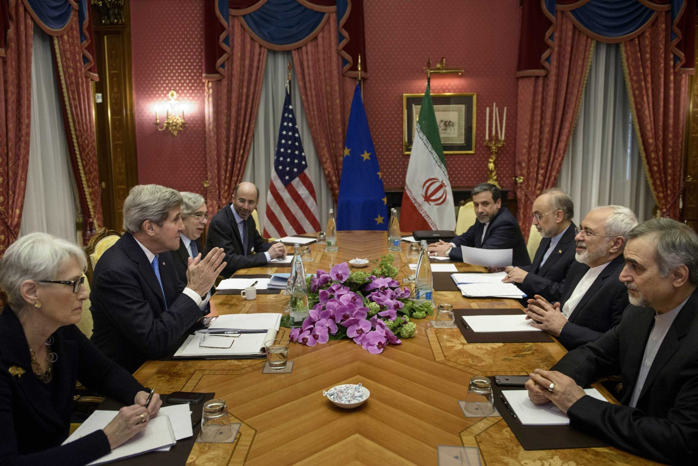 From left, U.S. Under Secretary for Political Affairs Wendy Sherman, U.S. Secretary of State John Kerry, U.S. Secretary of Energy Ernest Moniz, Robert Malley, member of the U.S. National Security Council, Iranian Deputy Foreign Minister Abbas Araghchi, Head of Iran Atomic Energy Organization Ali Akbar Salehi, Iranian Foreign Minister Javad Zarif and Hossein Fereydoon, special assistant to Iranian president, wait to start a meeting at the Beau Rivage Palace Hotel in Lausanne, Switzerland, March 29, 2015.