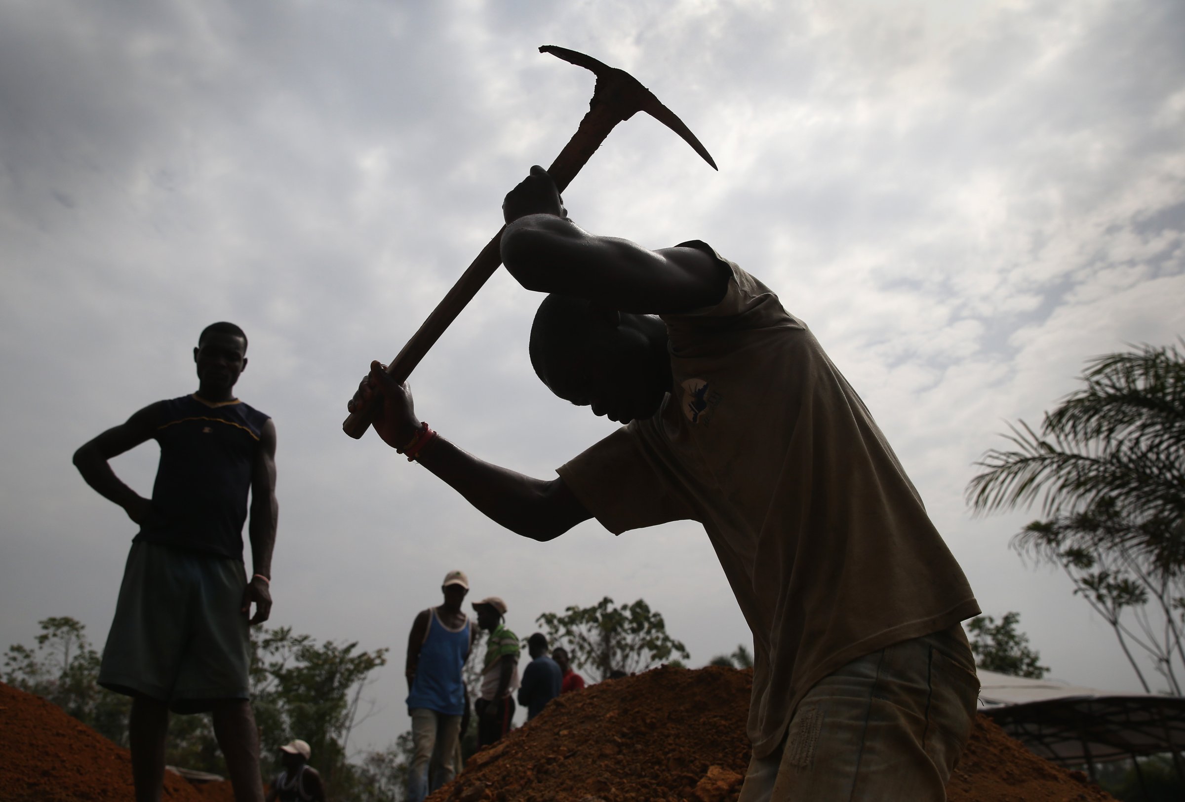 A grave digger works in the U.S.-built cemetery for "safe burials" on Jan. 27, 2015 in Disco Hill, Liberia.