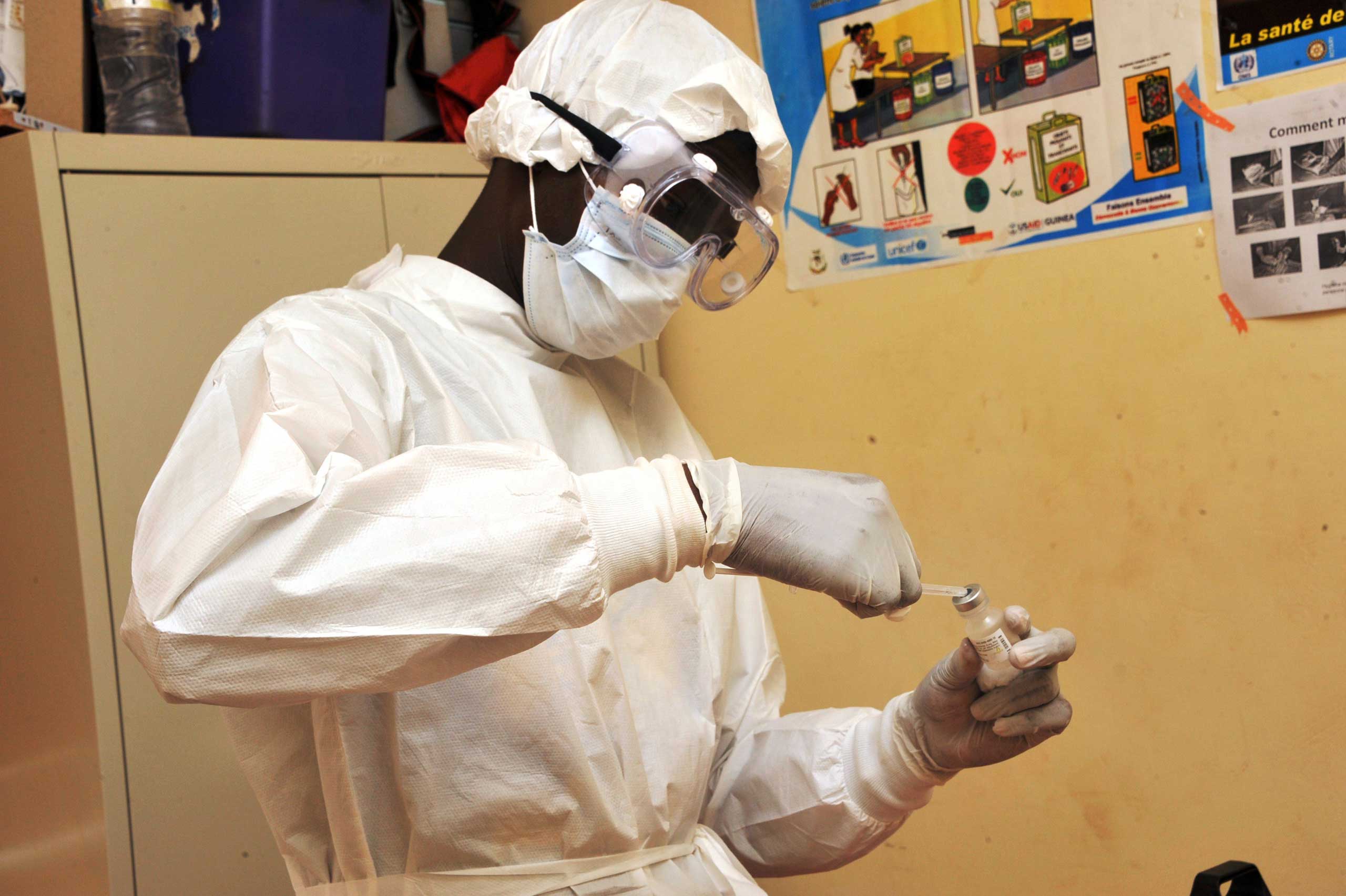 A health worker prepares a vaccination on March 10, 2015 at a health center in Conakry during the first clinical trials of the VSV-EBOV vaccine against the Ebola virus.