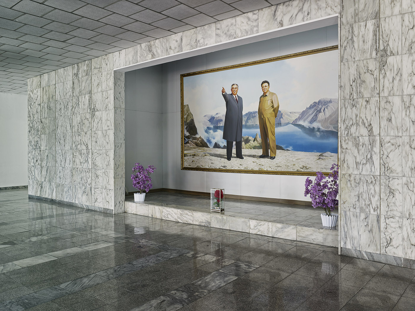Portrait of the Leaders, Jannamsan Hotel, Kaesong, Pyongyang.
                              There are a number of portraits of the North Korean leaders, featuring specific backdrops or content that have been officially approved and are displayed throughout the country. Artists who have been specially trained in reproducing the image of the leaders create all these portraits at Mansudae Art Studio in Pyongyang