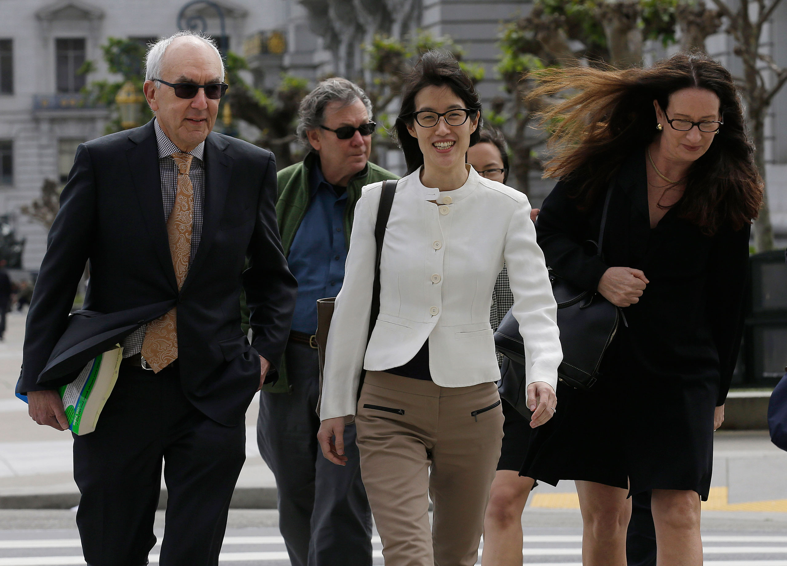 Ellen Pao, center, walks to Civic Center Courthouse in San Francisco, March 27, 2015. (Jeff Chiu—AP)