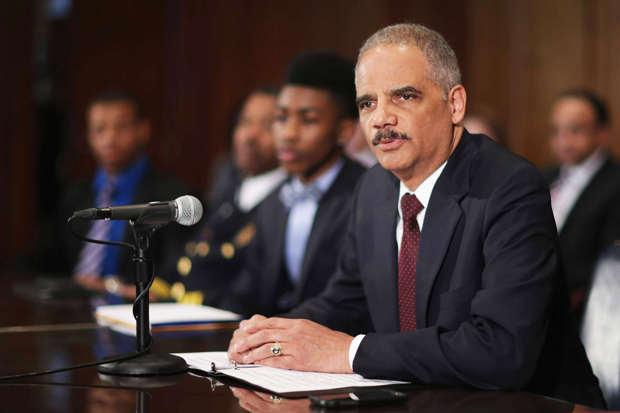 U.S. Attorney General Eric Holder delivers remarks about the shooting of two police officers in Ferguson, Mo., while announcing the first six pilot sites for the National Initiative for Building Community Trust and Justice at the Department of Justice in Washington, D.C., on March 12, 2015 (Chip Somodevilla&mdash;Getty Images)