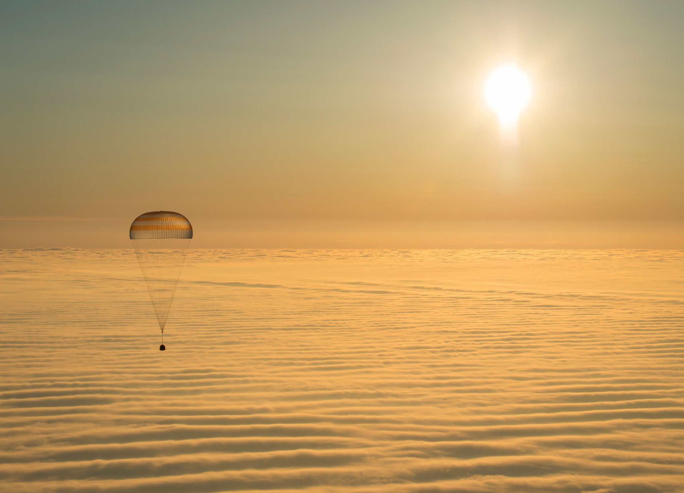 The Soyuz TMA-14M spacecraft as it lands with Expedition 42 commander Barry Wilmore of NASA, Alexander Samokutyaev of the Russian Federal Space Agency (Roscosmos) and Elena Serova of Roscosmos near the town of Zhezkazgan, Kazakhstan on March 12, 2015.