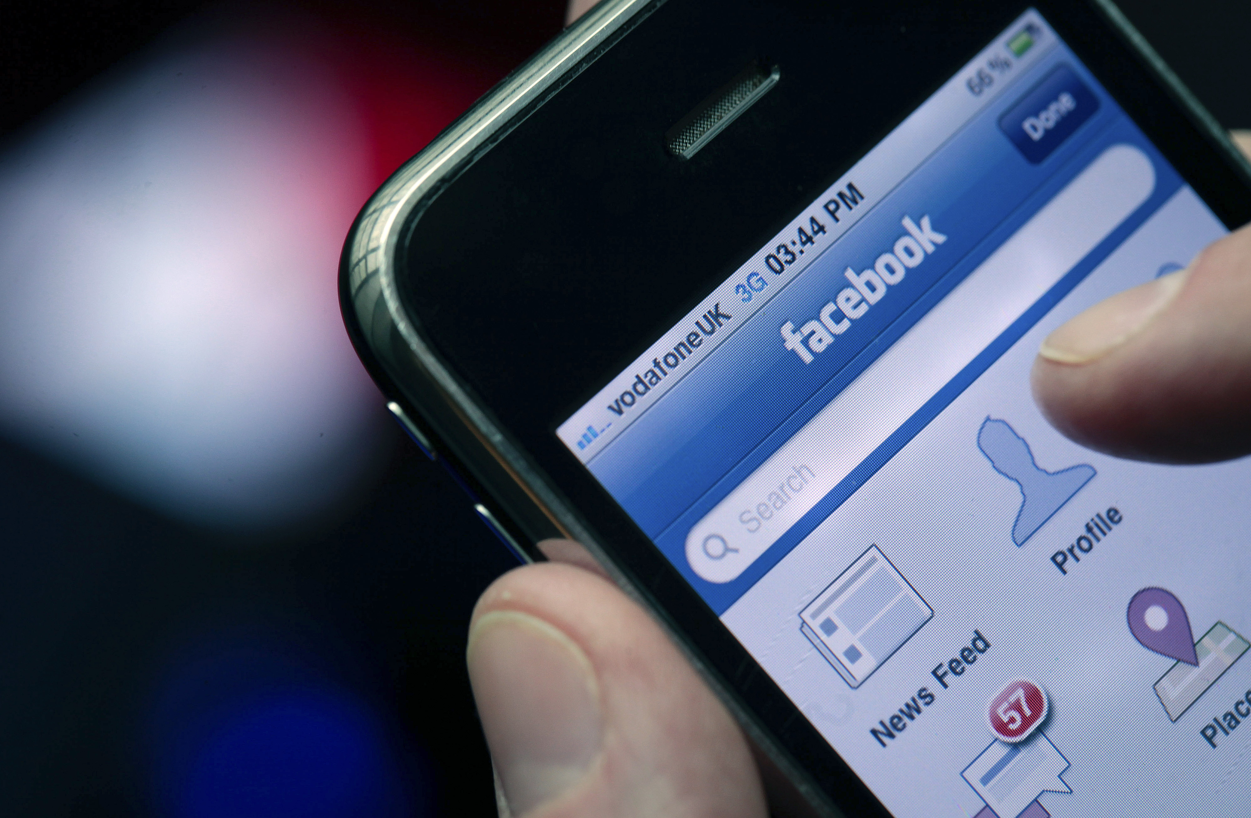 The Facebook Inc. logo is seen on an Apple Inc. iPhone in London, U.K., on May 14, 2012. (Bloomberg via Getty Images)
