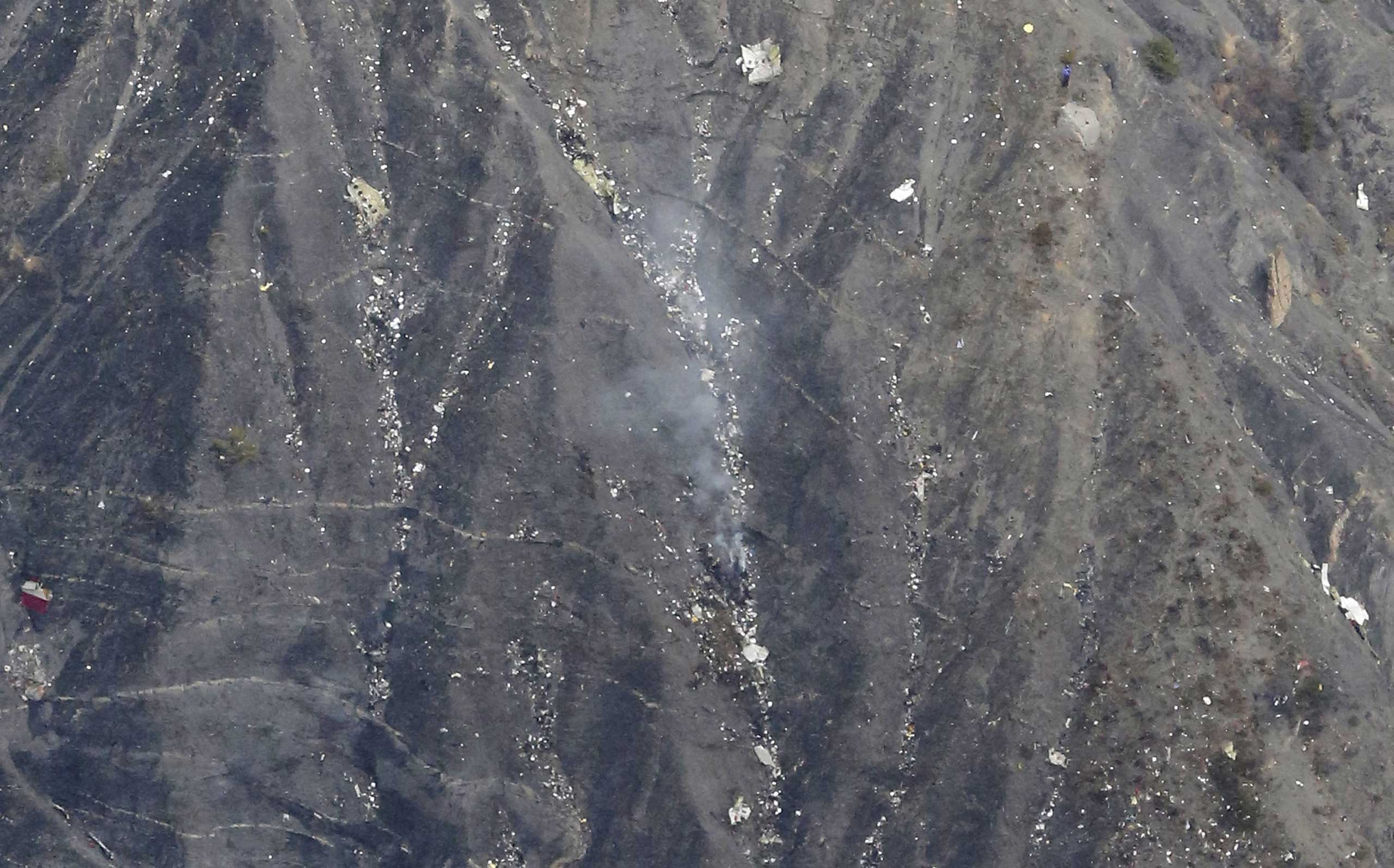 An aerial photo shows what appears to be wreckage from the crash of a Germanwings plane in the French Alps, between Barcelona and Digne, March 24, 2015.