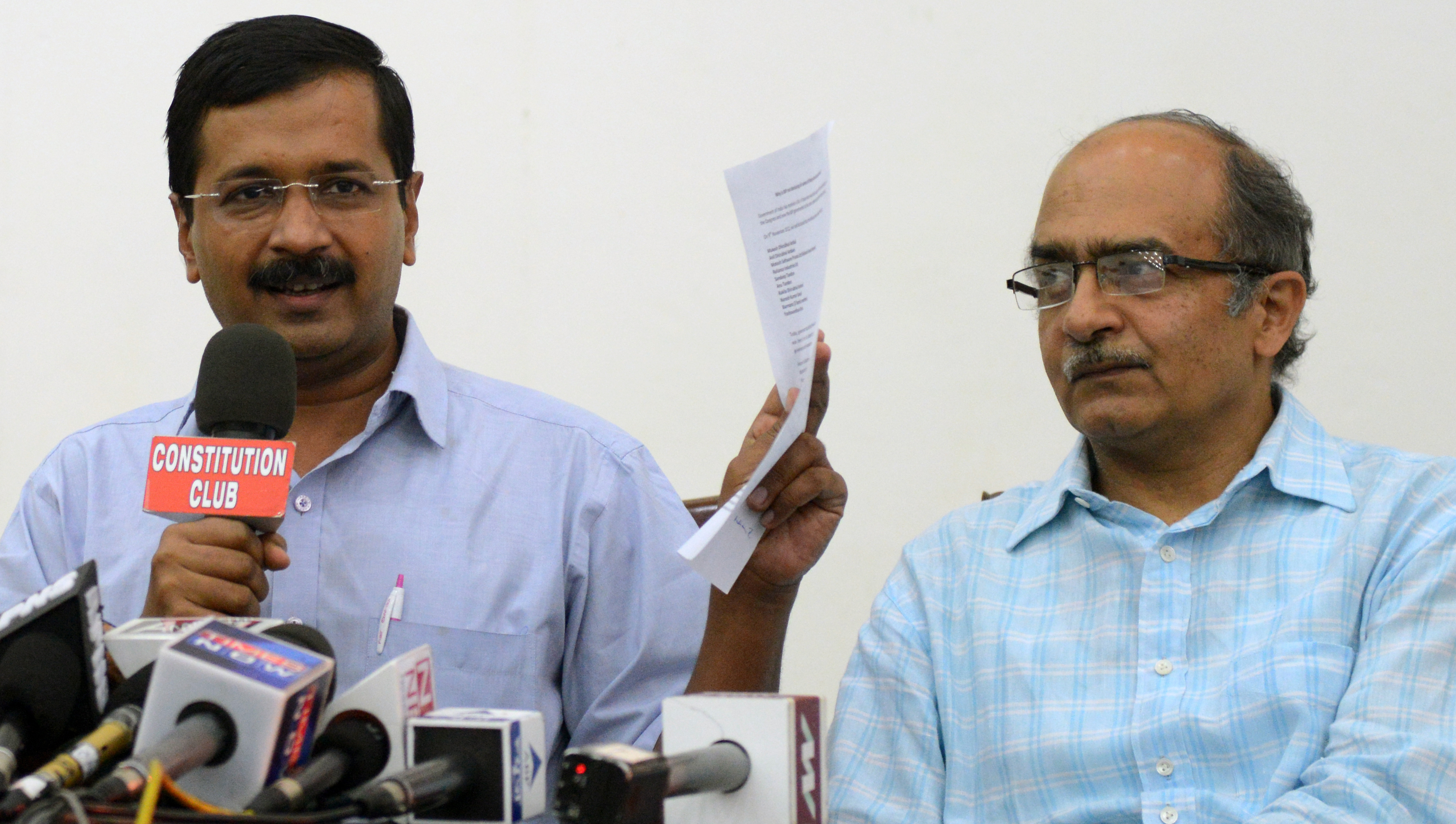 Aam Aadmi Party convener Arvind Kejriwal and Prashant Bhushan addressing the media in New Delhi (Praveen Negi—India Today Group/Getty Images)