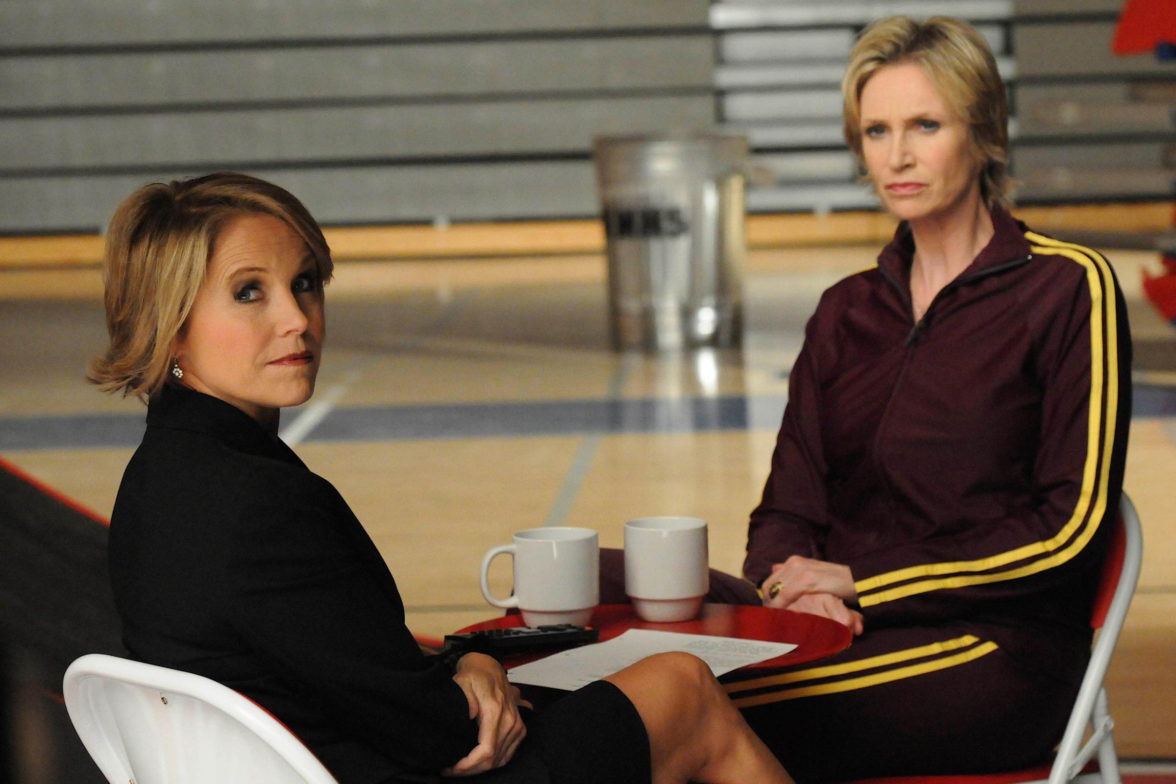 GLEE: Guest star Katie Couric (as herself, L) interviews Sue (Jane Lynch, R) in a special episode of GLEE airing after SUPER BOWL XLV on Sunday, Feb. 6 (approx. 10:30-11:30 PM ET; approx. 7:30-8:30 PM PT) on FOX.  &#xa9;2011 Fox Broadcasting Co. Cr: Michael Yarish/FOX