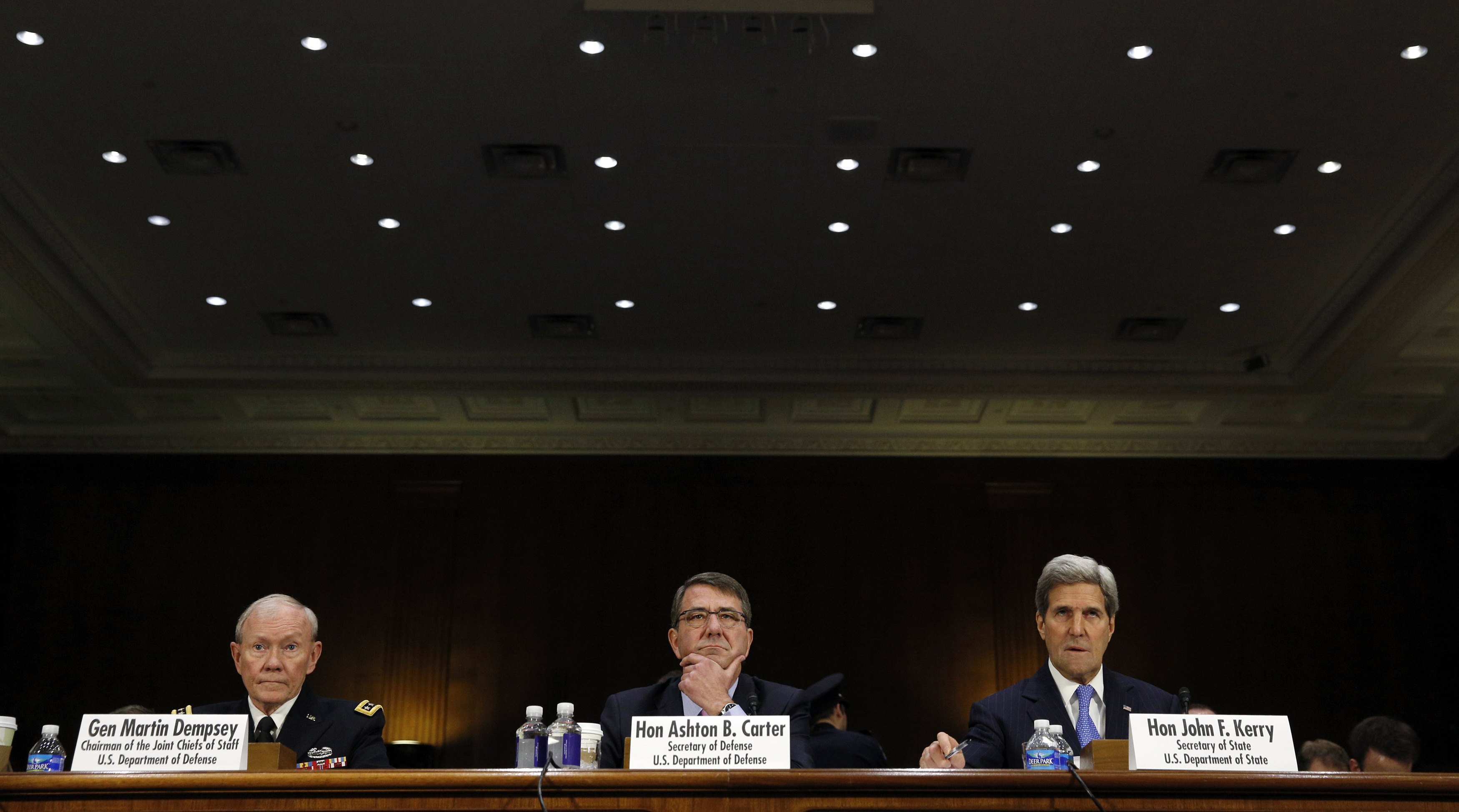 Joint Chiefs of Staff Chairman Army Gen. Martin Dempsey (L), U.S. Defense Secretary Ash Carter (C) and Secretary of State John Kerry testify at a Senate Foreign Relations Committee hearing on "The President's Request for Authorization to Use Force Against ISIS: Military and Diplomatic Efforts"
                      on Capitol Hill in Washington on March 11, 2015. (Kevin Lamargue—Reuters)