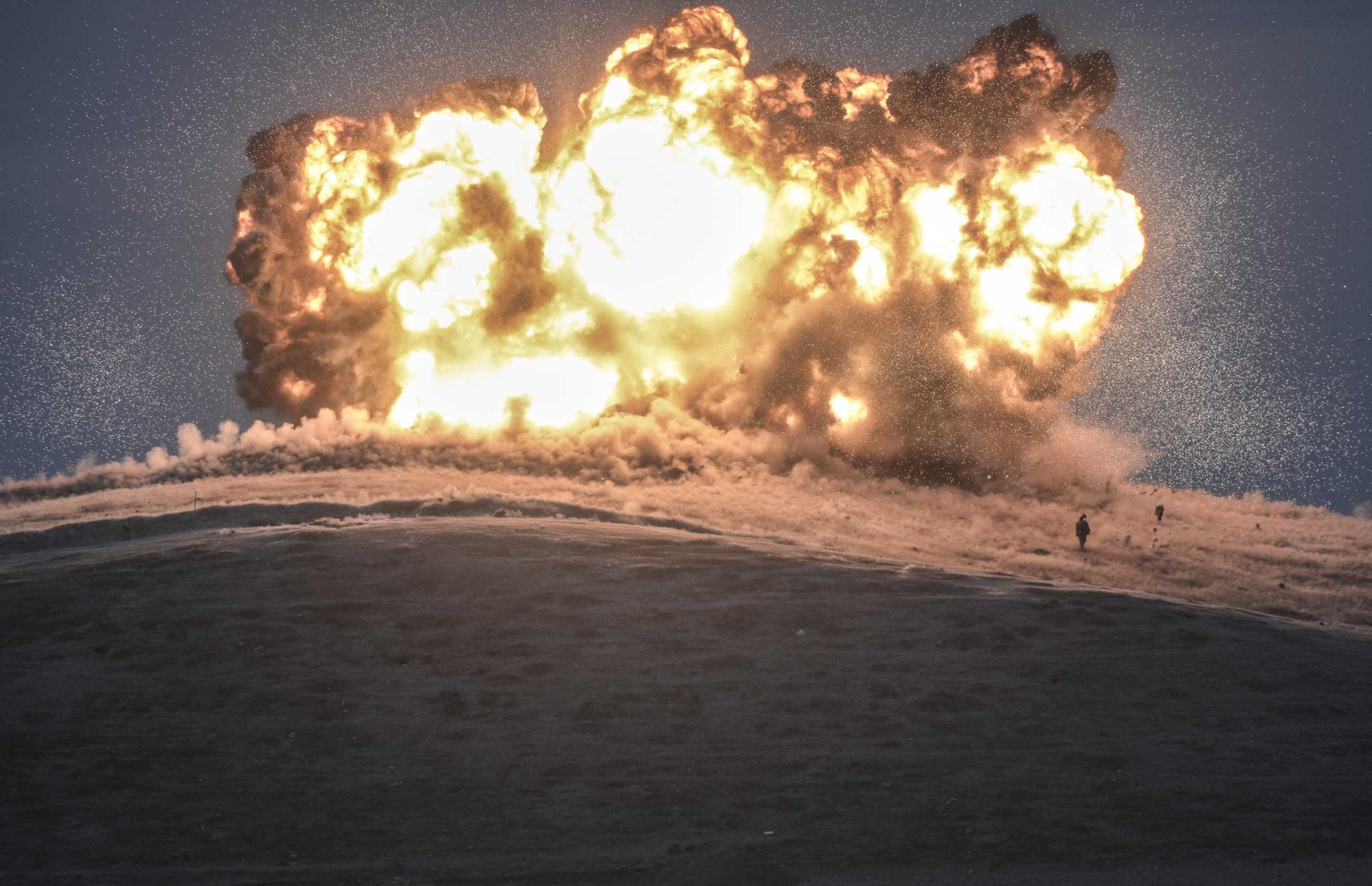 Militants of Islamic State (IS) stand just before explosion of a